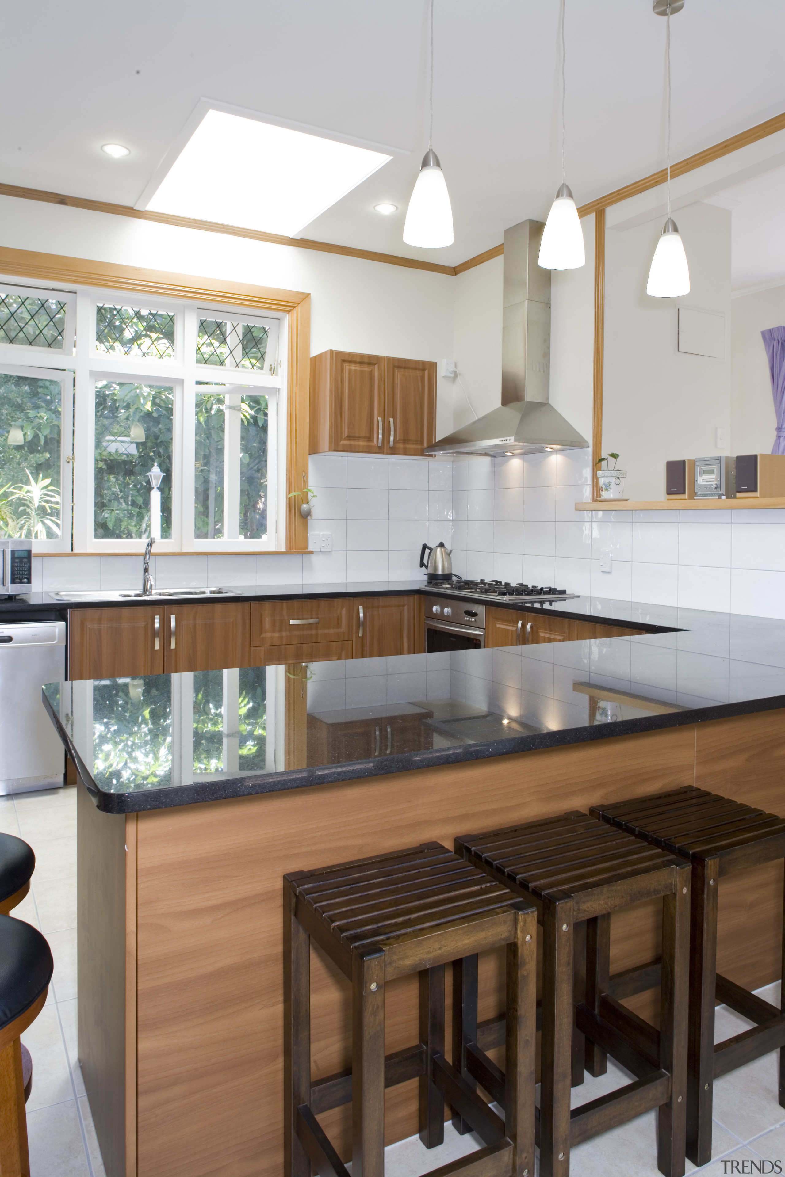 Dark cabinetry and black granite benchtop inside U-shaped cabinetry, countertop, cuisine classique, interior design, kitchen, real estate, room, gray, white, brown