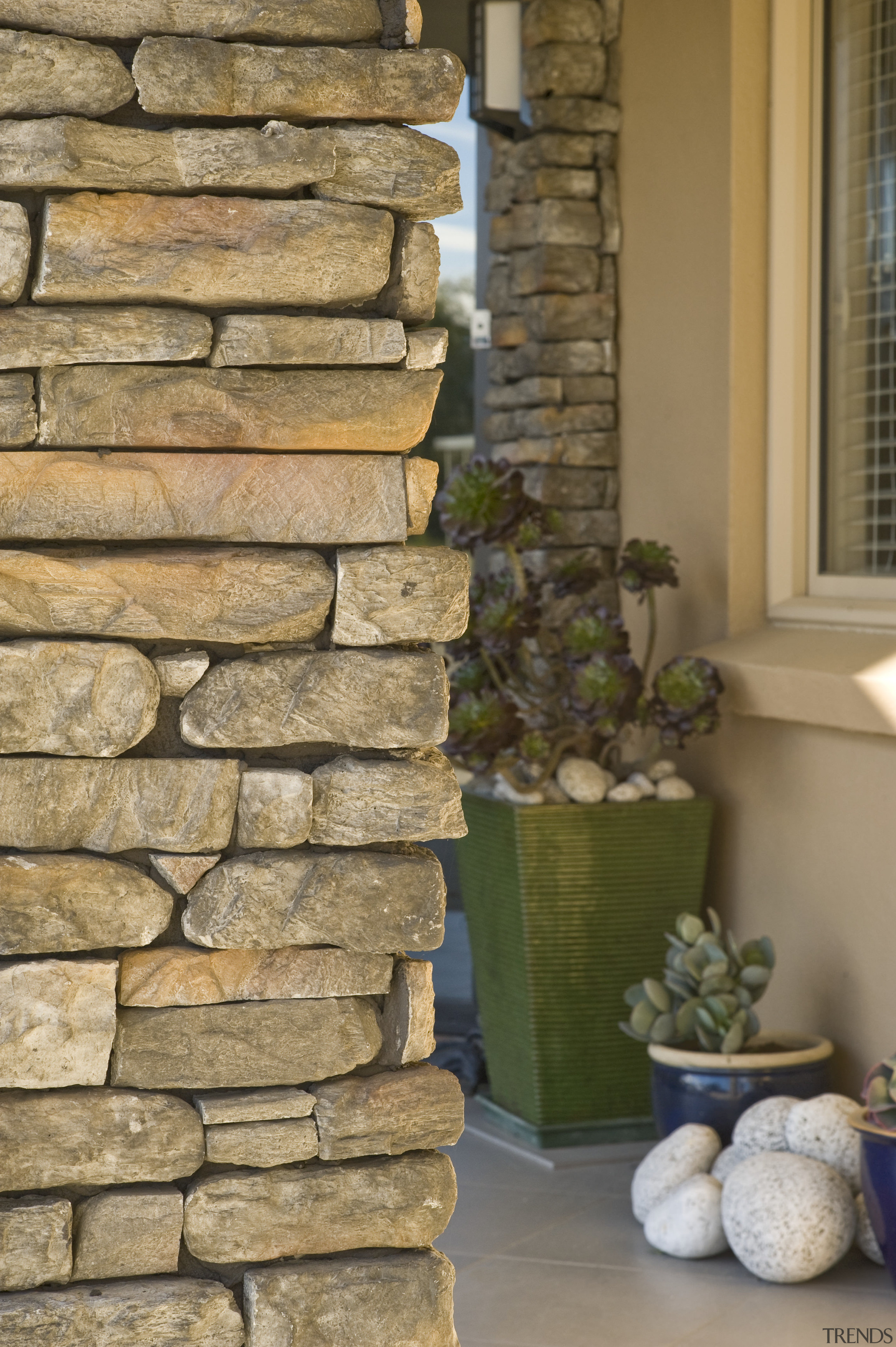 Image of this new home in central Otago stone wall, wall, window, wood, brown, orange