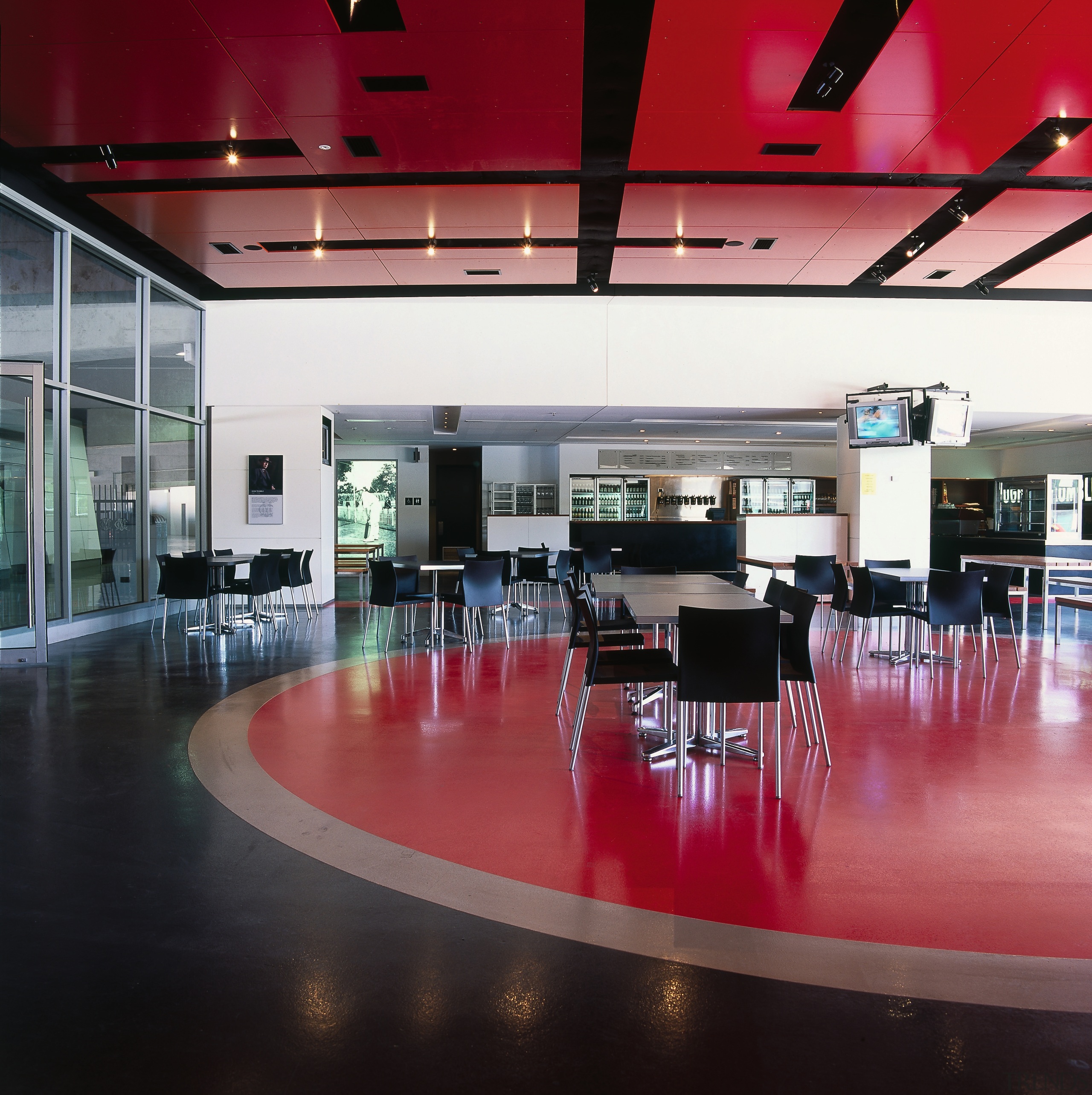 Large public cafe with charcoal, stone grey and interior design, black, red