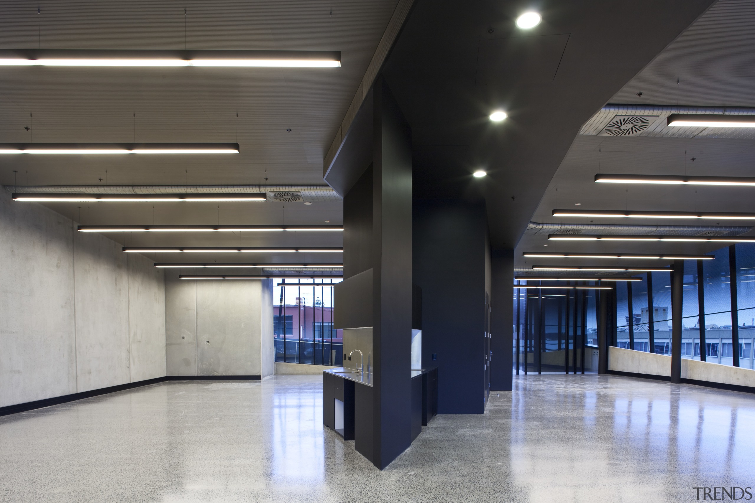 View of the Anvil Building, with angled custom architecture, ceiling, daylighting, floor, interior design, lobby, gray, black