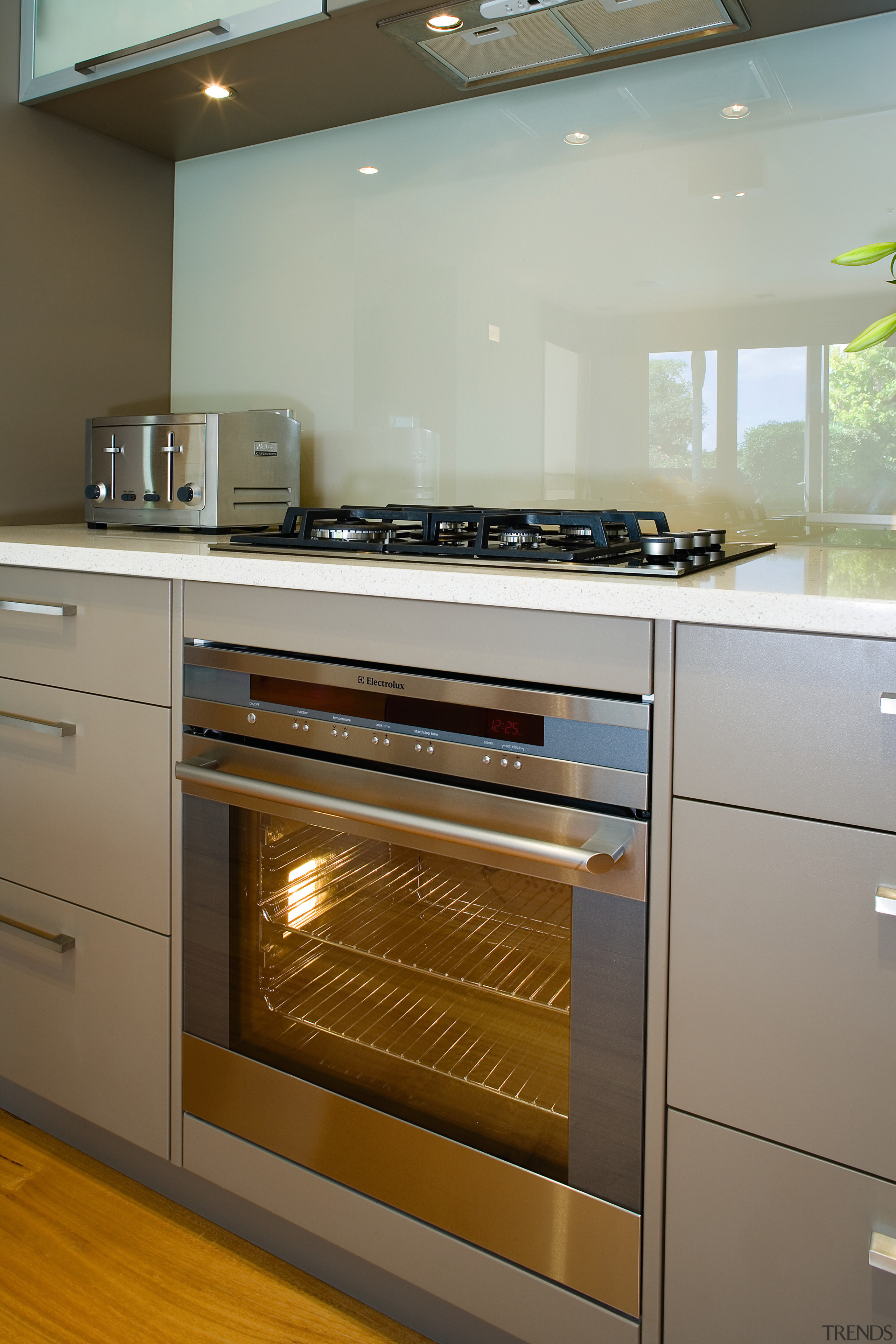 A view of some kitchen appliaces from Electrolux. cabinetry, countertop, gas stove, home appliance, interior design, kitchen, kitchen appliance, kitchen stove, major appliance, oven, room, gray, brown