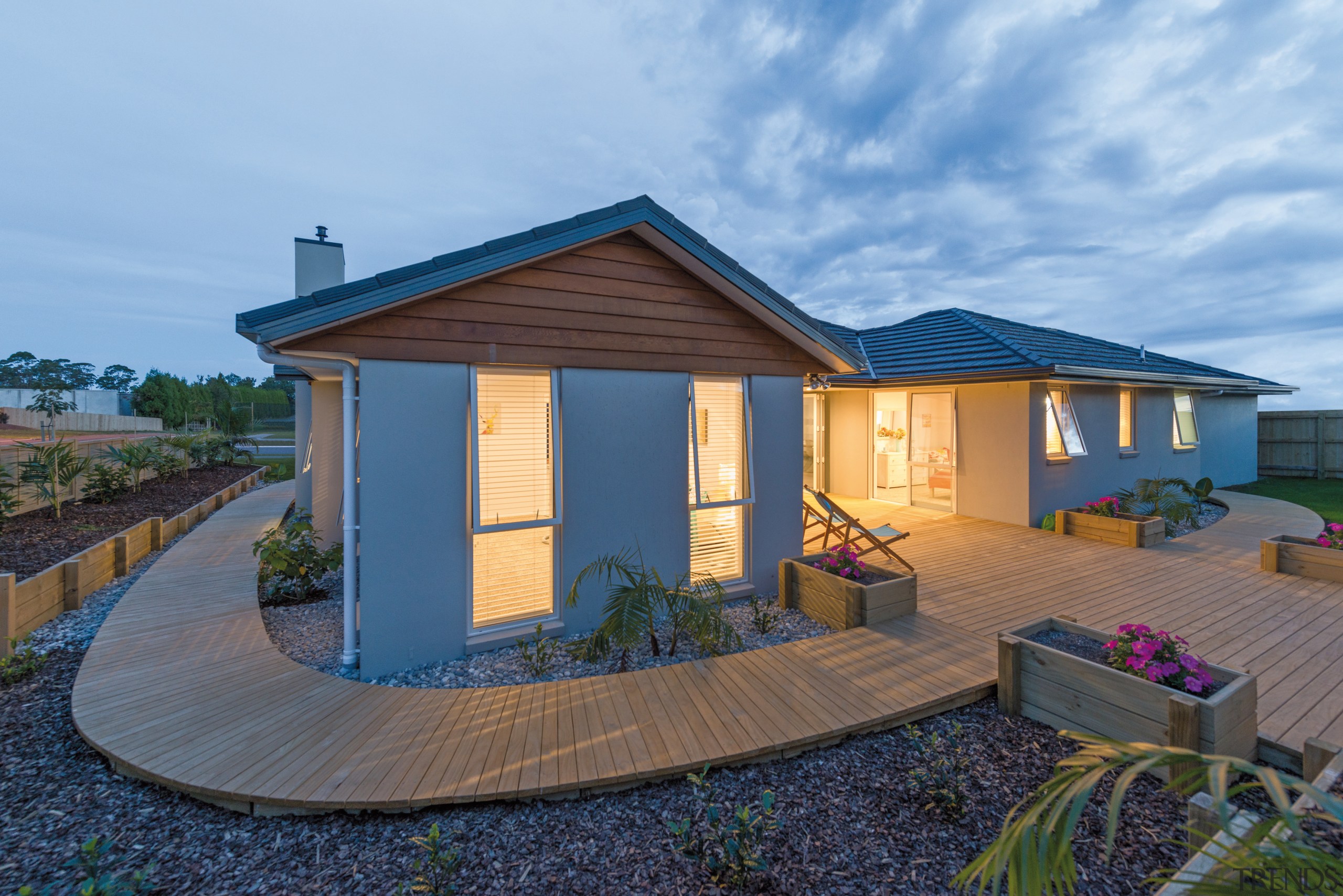 This new show home in Kerikeri was built cottage, estate, facade, home, house, property, real estate, roof, shed, siding, sky, teal