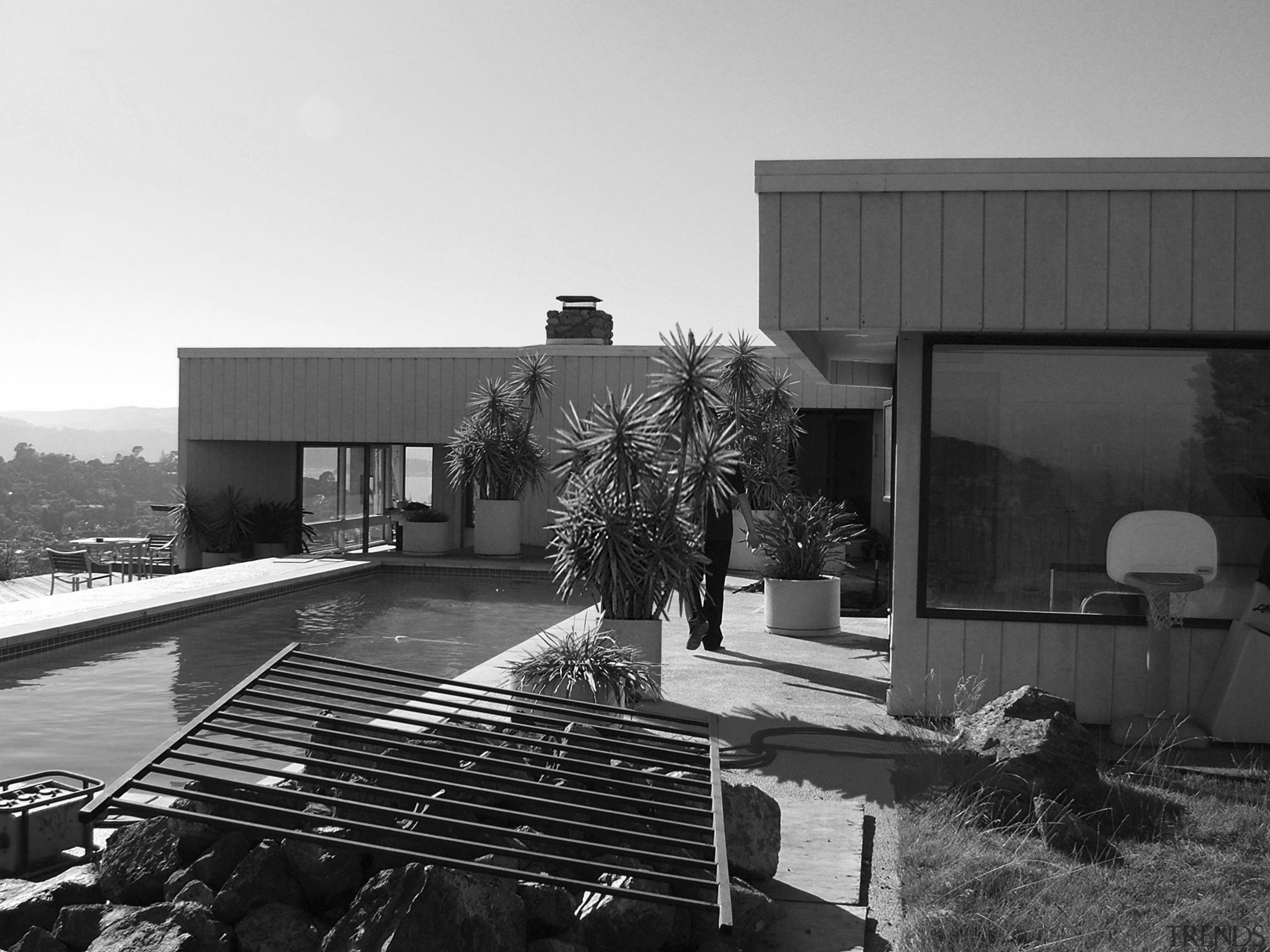 This house was remodeled by Robert Swatt of architecture, black and white, building, facade, home, house, monochrome, monochrome photography, residential area, roof, black, white