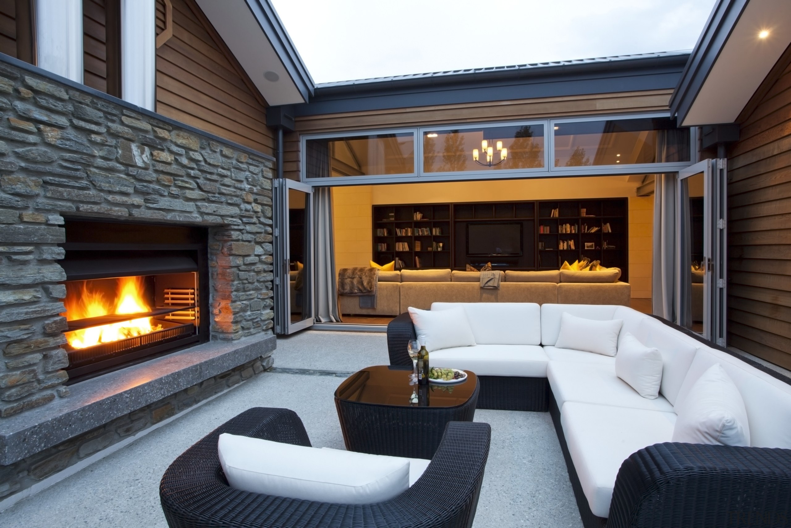 View of the outdoor living area, fireplace from estate, fireplace, hearth, home, interior design, living room, real estate, black