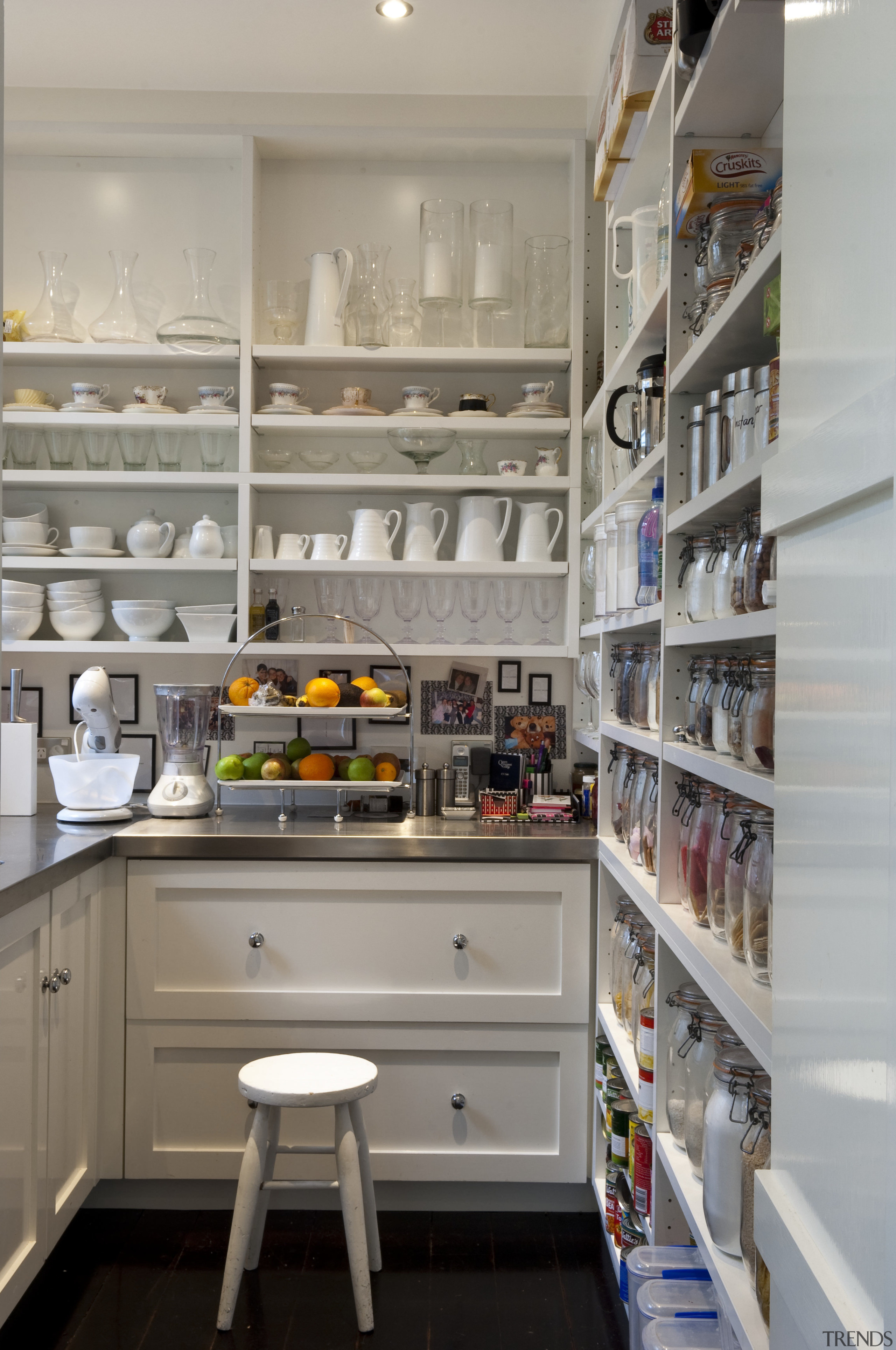 Creating a new tradition This kitchen references the countertop, kitchen, pantry, shelf, shelving, gray