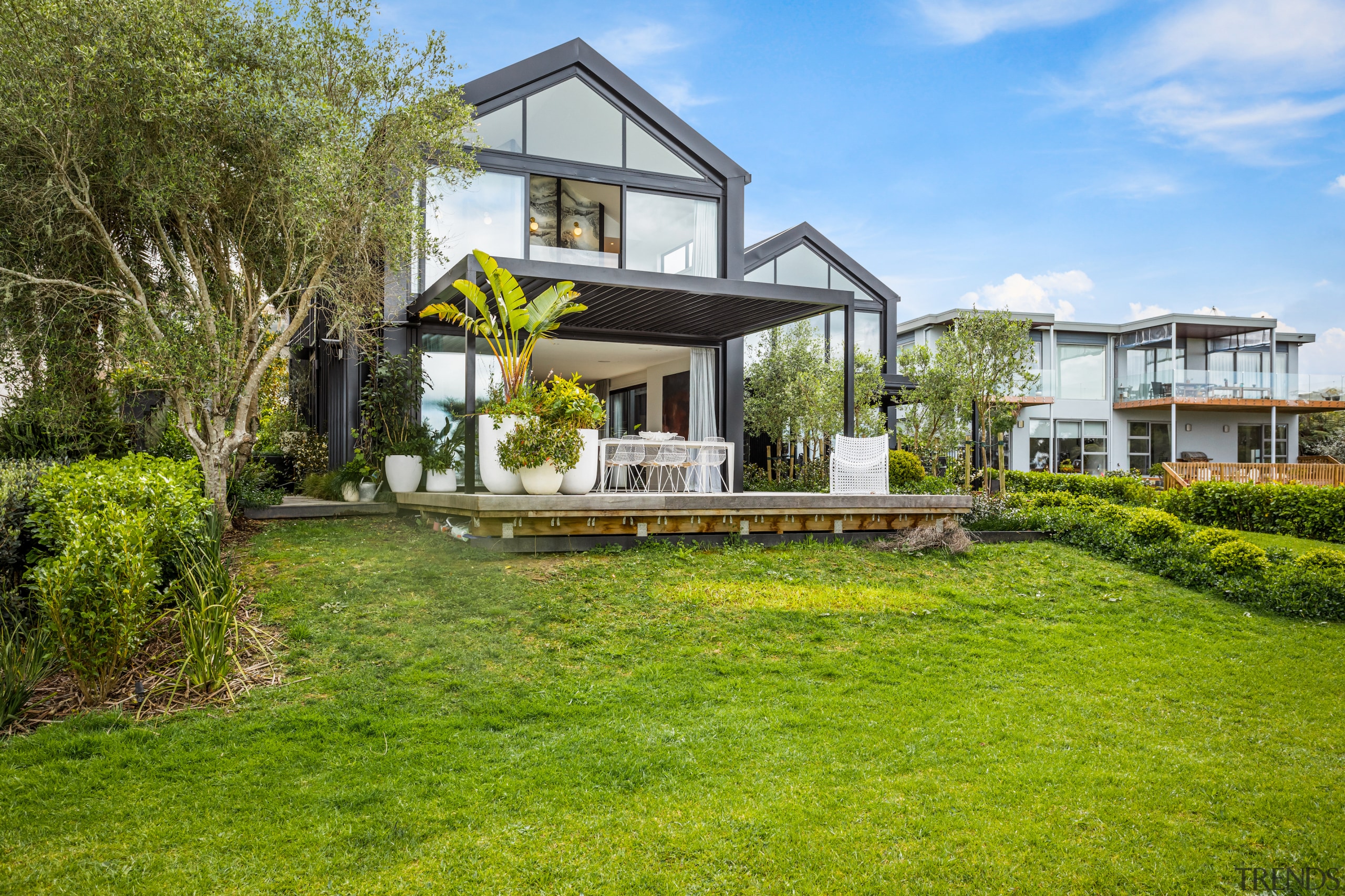 The master bedroom's dramatic headboard can be seen 