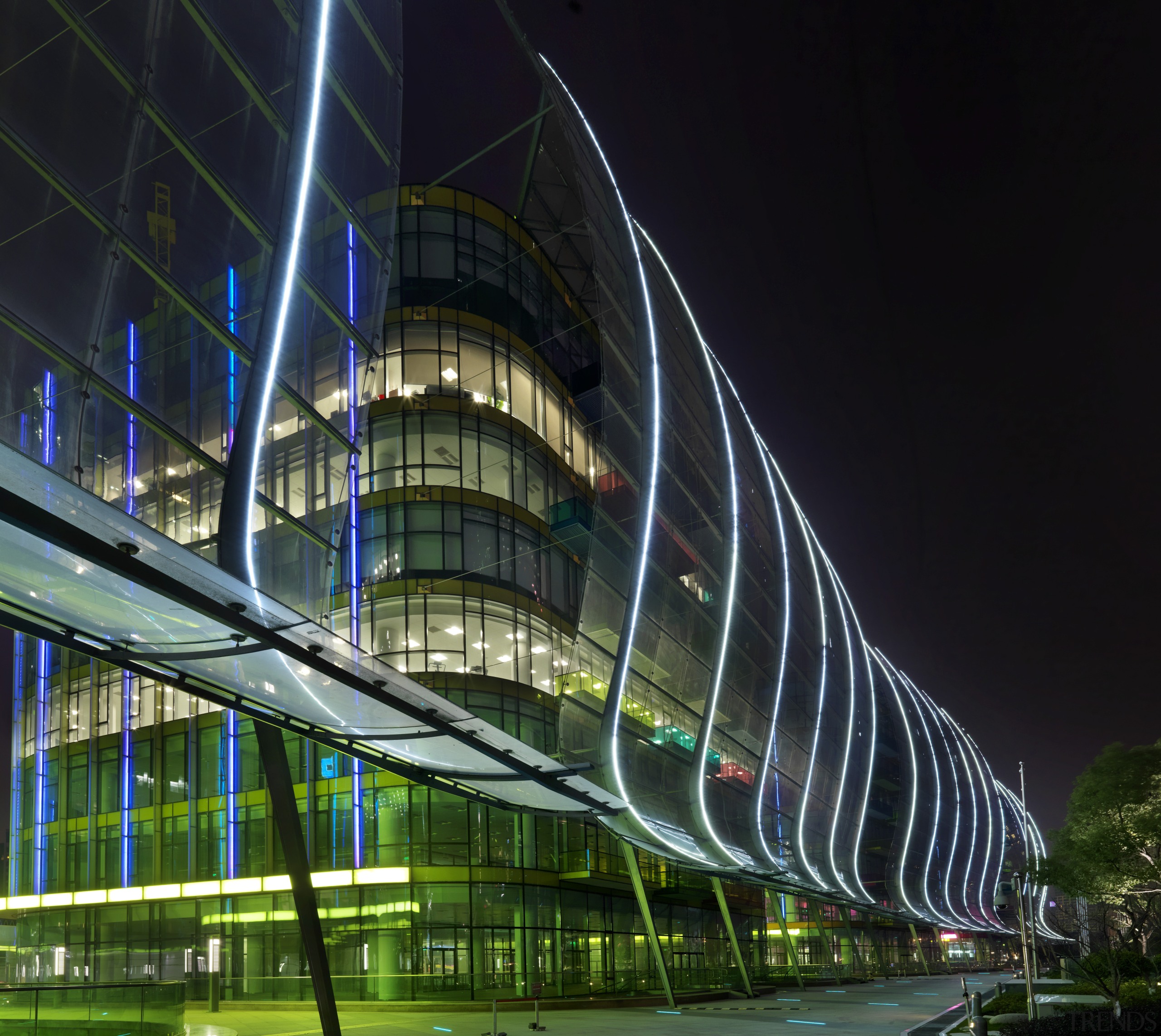 View of the Shanghai International Cruise Terminal. architecture, building, city, cityscape, convention center, corporate headquarters, facade, headquarters, landmark, light, line, metropolis, metropolitan area, mixed use, night, reflection, sky, structure, tower block, urban area, urban design, black