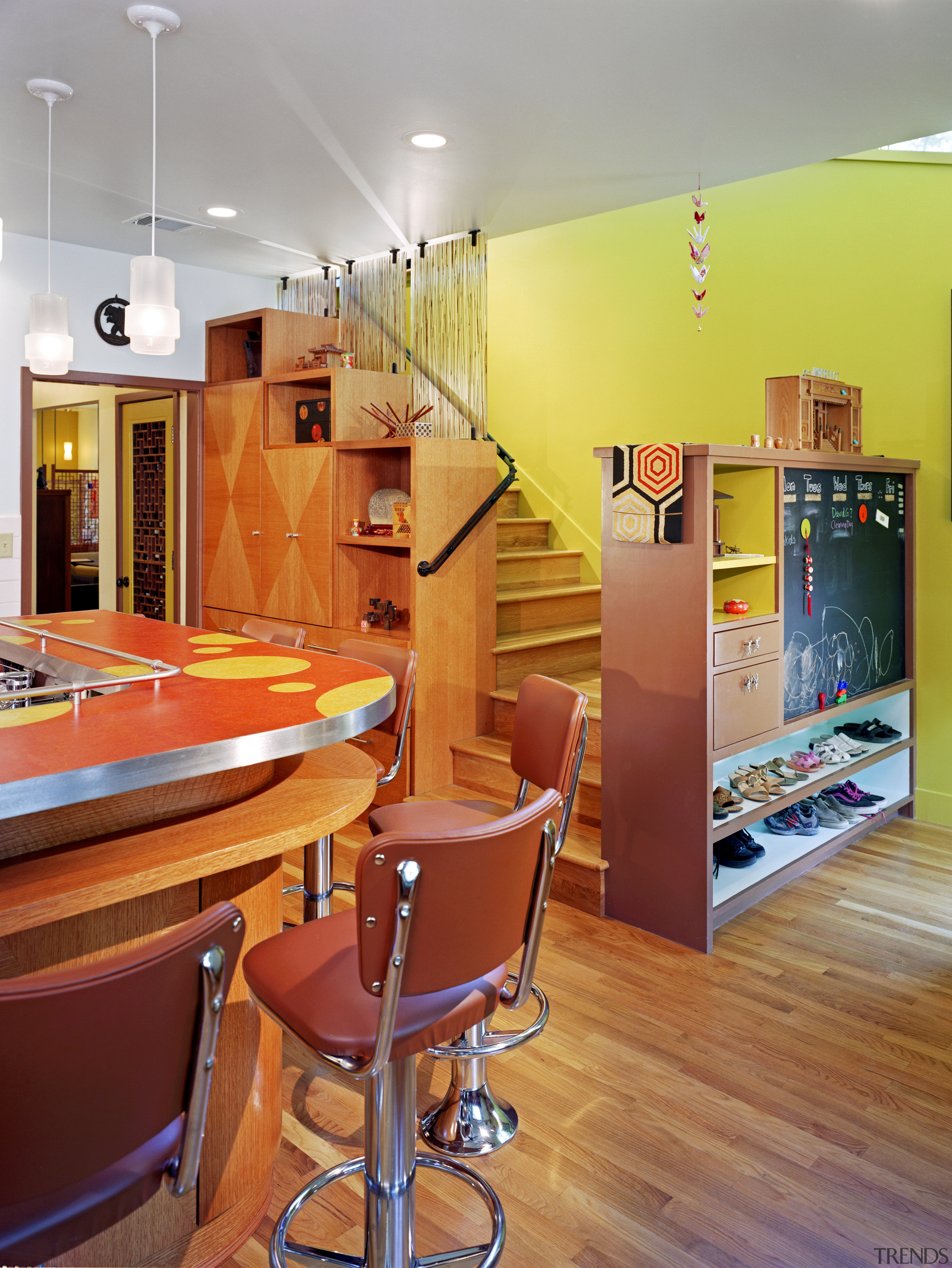 view of kitchen showing stairway leading to next architecture, ceiling, floor, flooring, home, interior design, kitchen, living room, loft, orange, real estate, room, table, wall, red, gray