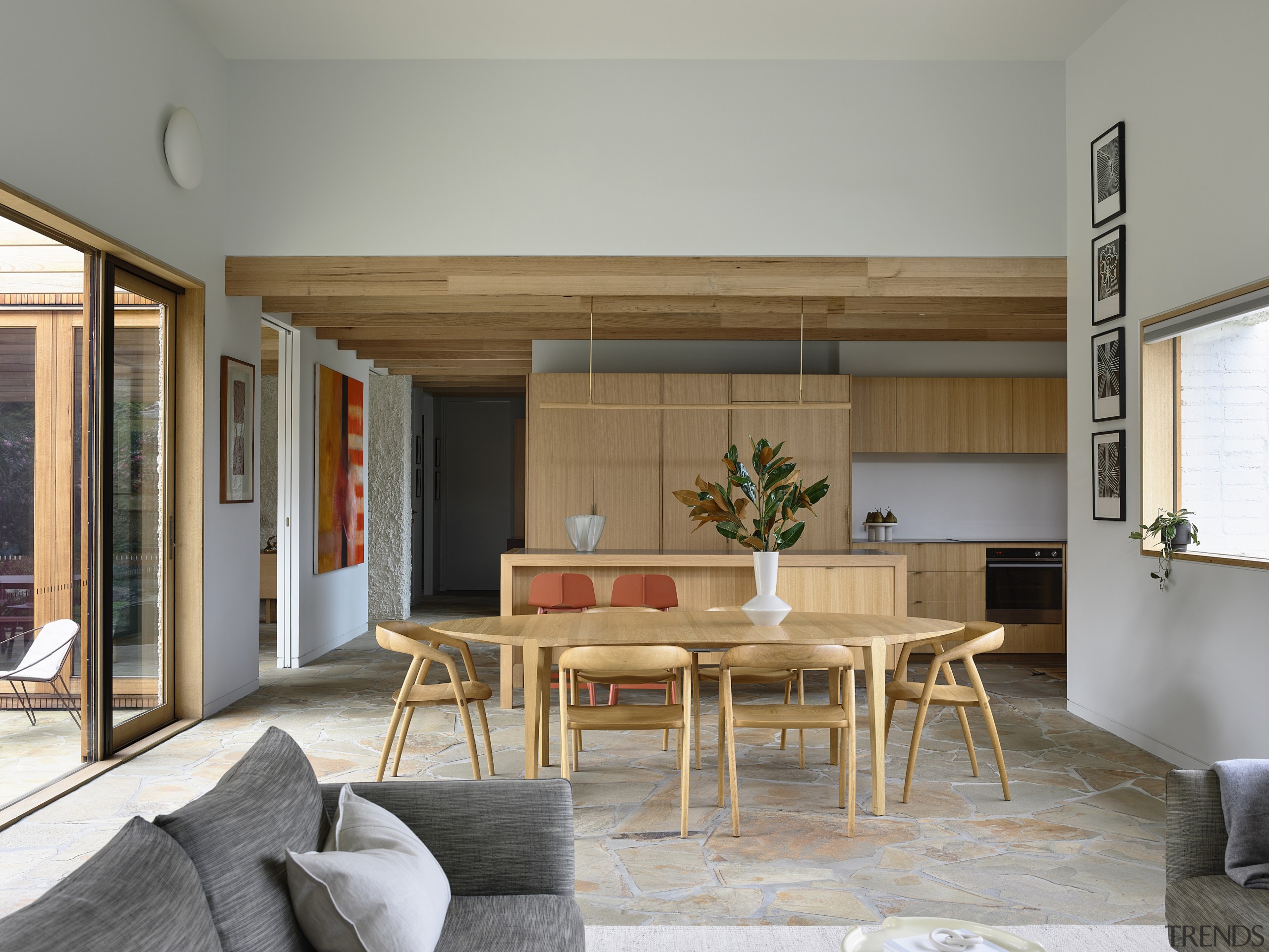 The main living/dining/kitchen space. Castlemaine slate pavers continue 