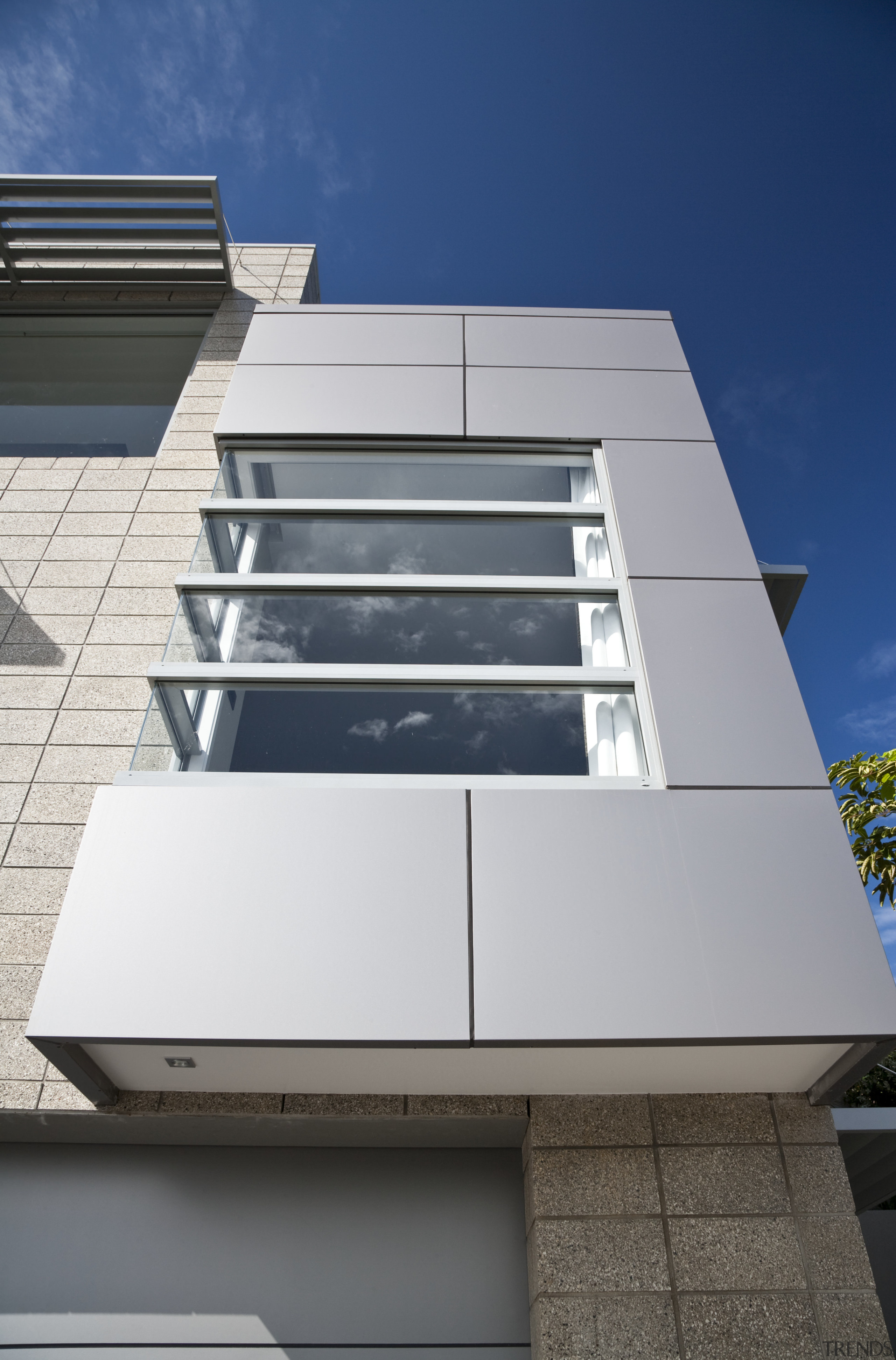 View of a house which features aluminium joinery angle, architecture, building, commercial building, condominium, daylighting, daytime, elevation, facade, glass, house, line, product design, residential area, sky, wall, gray, blue