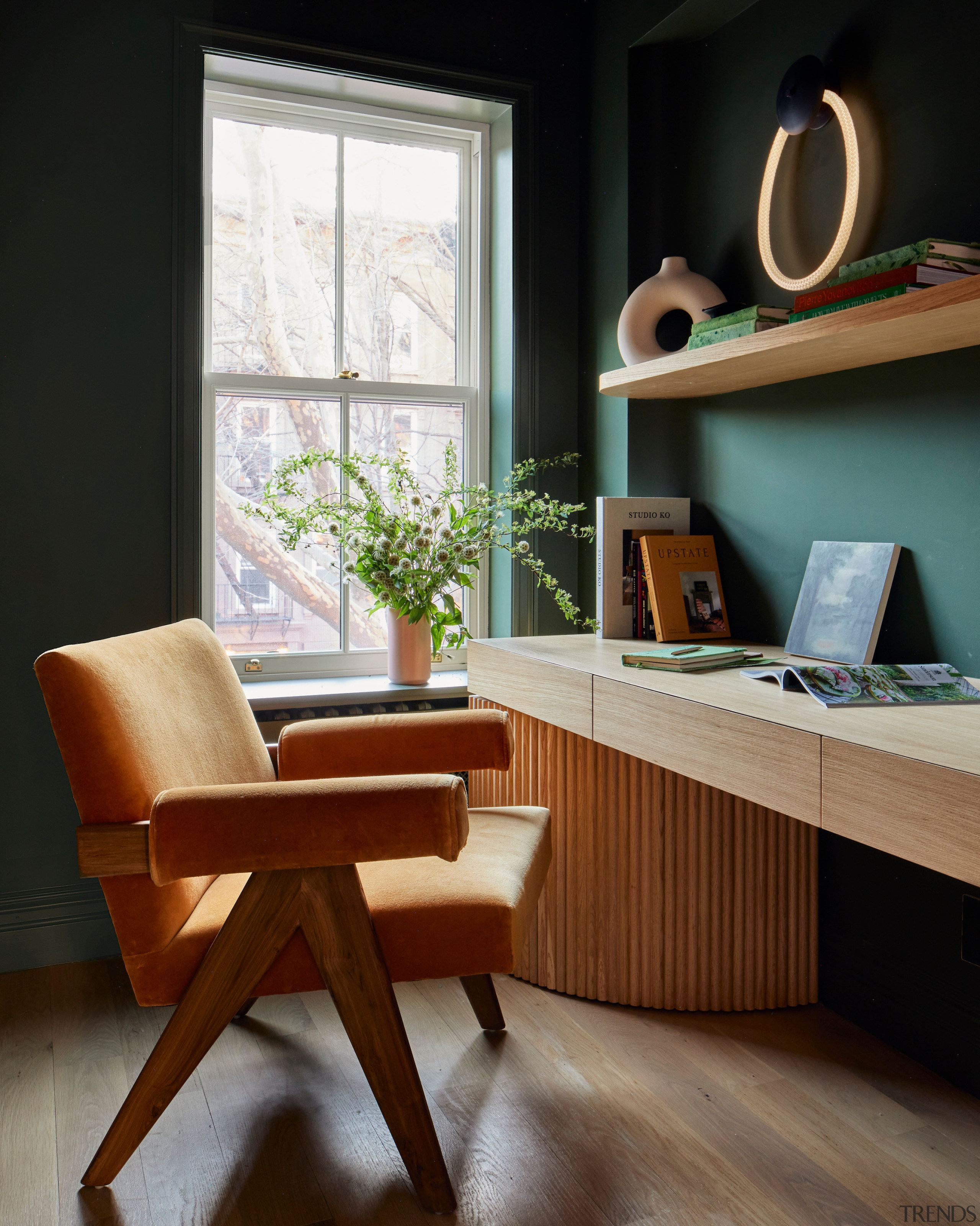 A home office with a custom tambour white 