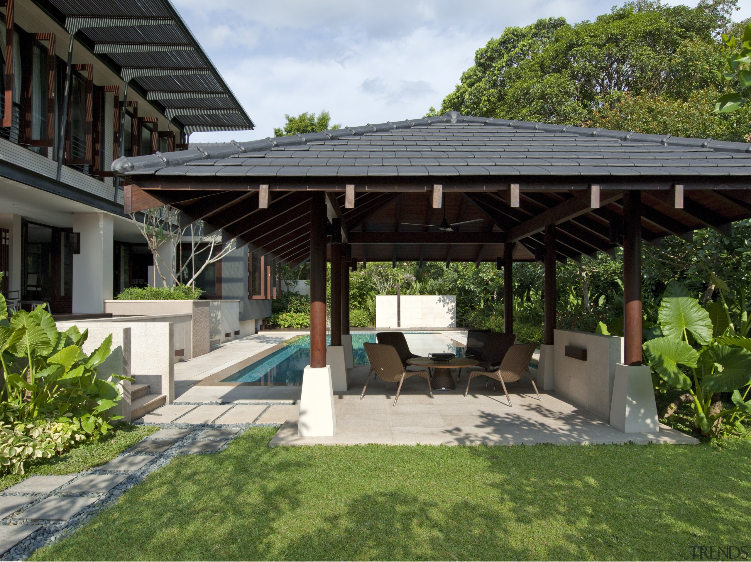 View of the outdoor pool area which features backyard, estate, house, outdoor structure, pavilion, property, real estate, roof, villa, green