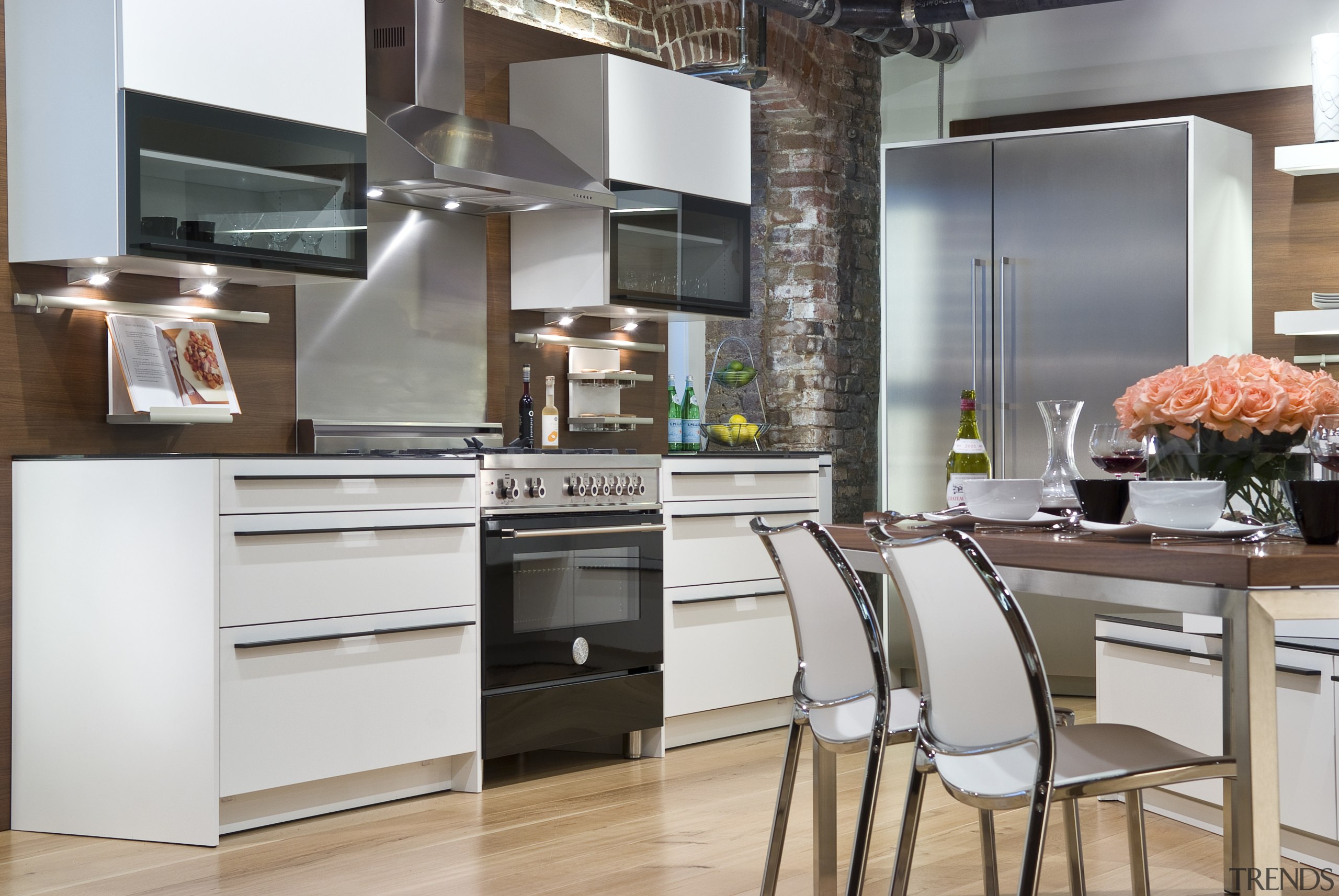 View of a contemporary kitchen which features a cabinetry, countertop, cuisine classique, home appliance, interior design, kitchen, kitchen appliance, refrigerator, small appliance, gray