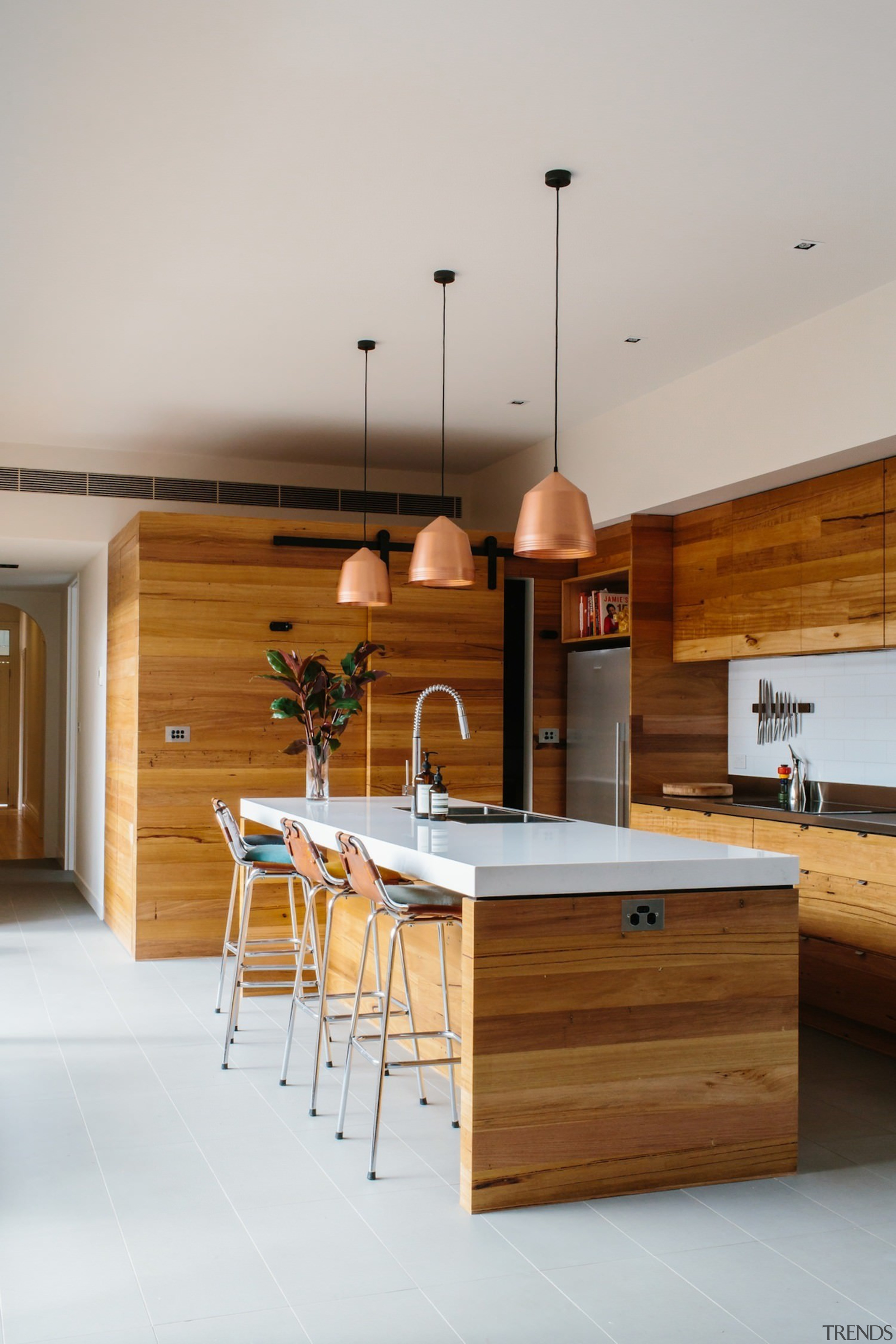 The white counter top draws the eye. - architecture, countertop, furniture, hardwood, house, interior design, kitchen, product design, table, wood, gray, brown