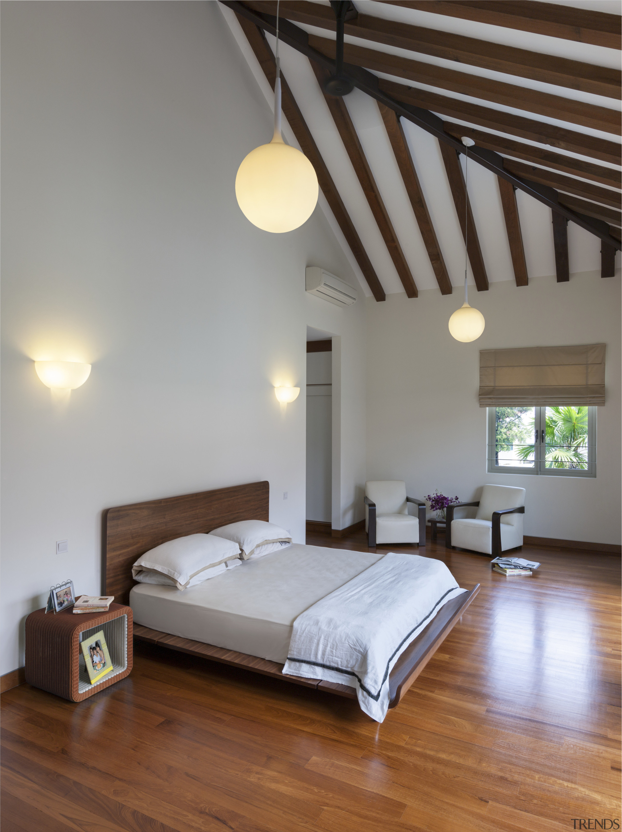 The master bedroom in this home is in architecture, bed, bed frame, bedroom, ceiling, daylighting, estate, floor, flooring, furniture, hardwood, home, interior design, mattress, real estate, room, suite, wood, wood flooring, gray, brown