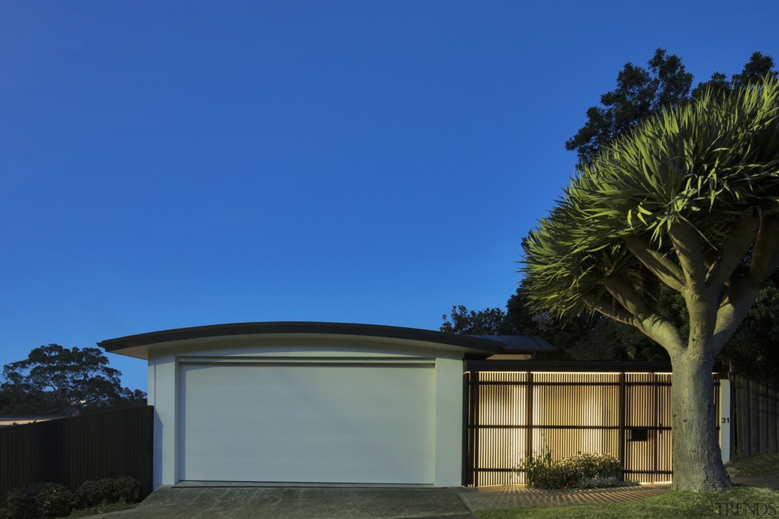 The home presents a clean facade to the architecture, building, cottage, estate, facade, home, house, property, real estate, residential area, roof, sky, tree, villa, blue