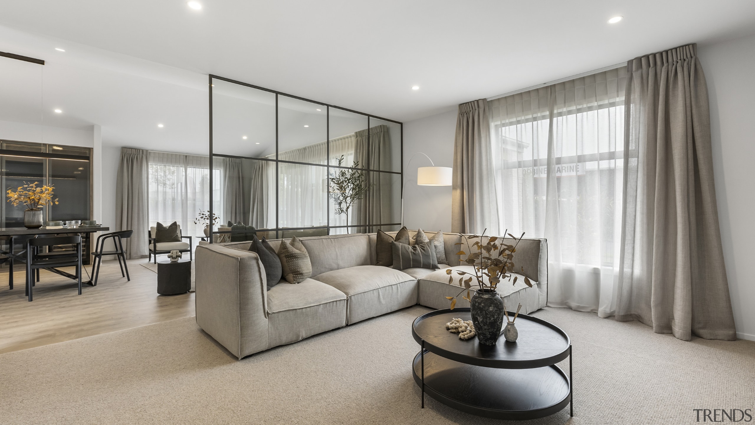 The open plan entertainment space features a refined 