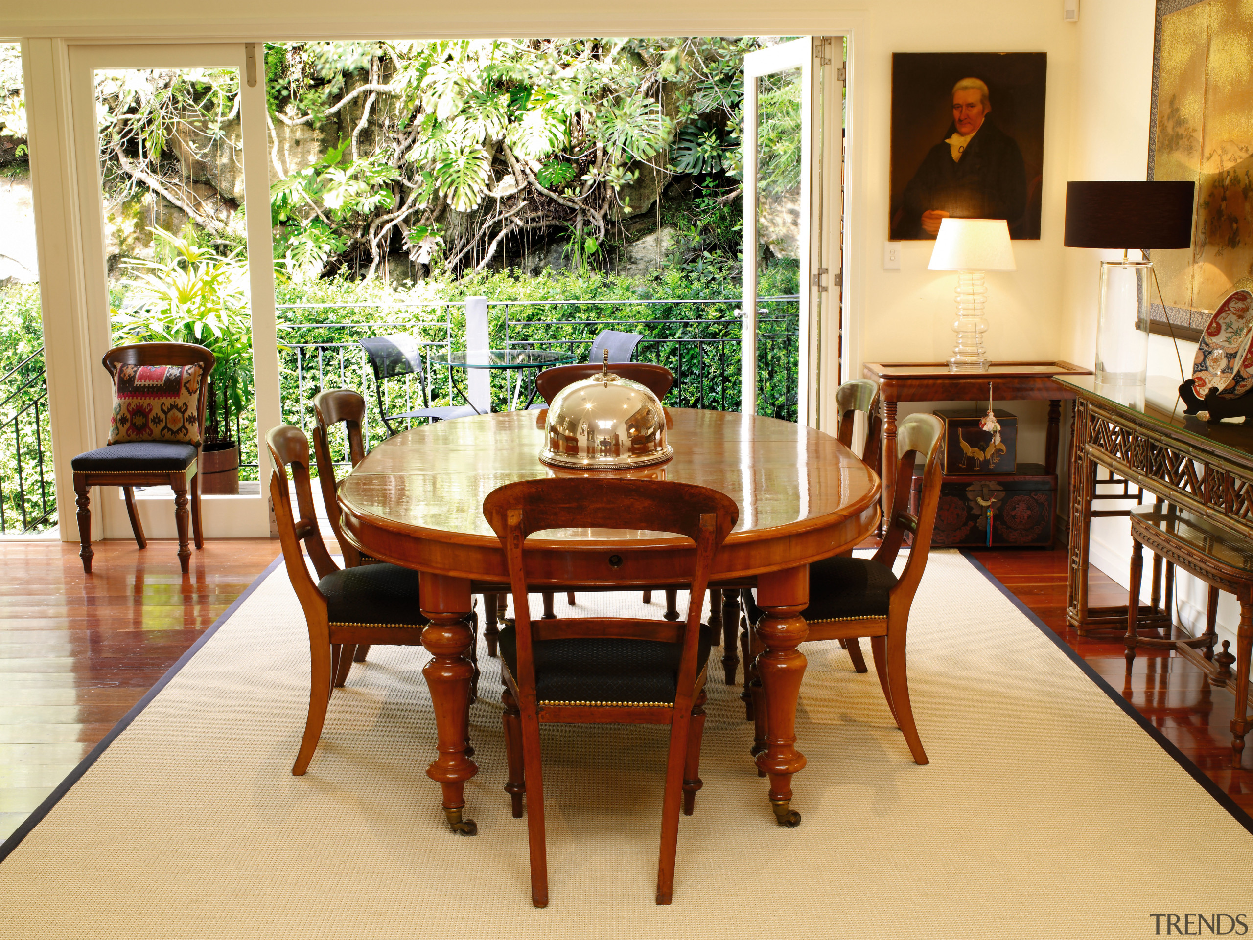 A complete rethink of the residence's rear wall, chair, dining room, flooring, furniture, hardwood, interior design, living room, property, room, table, orange