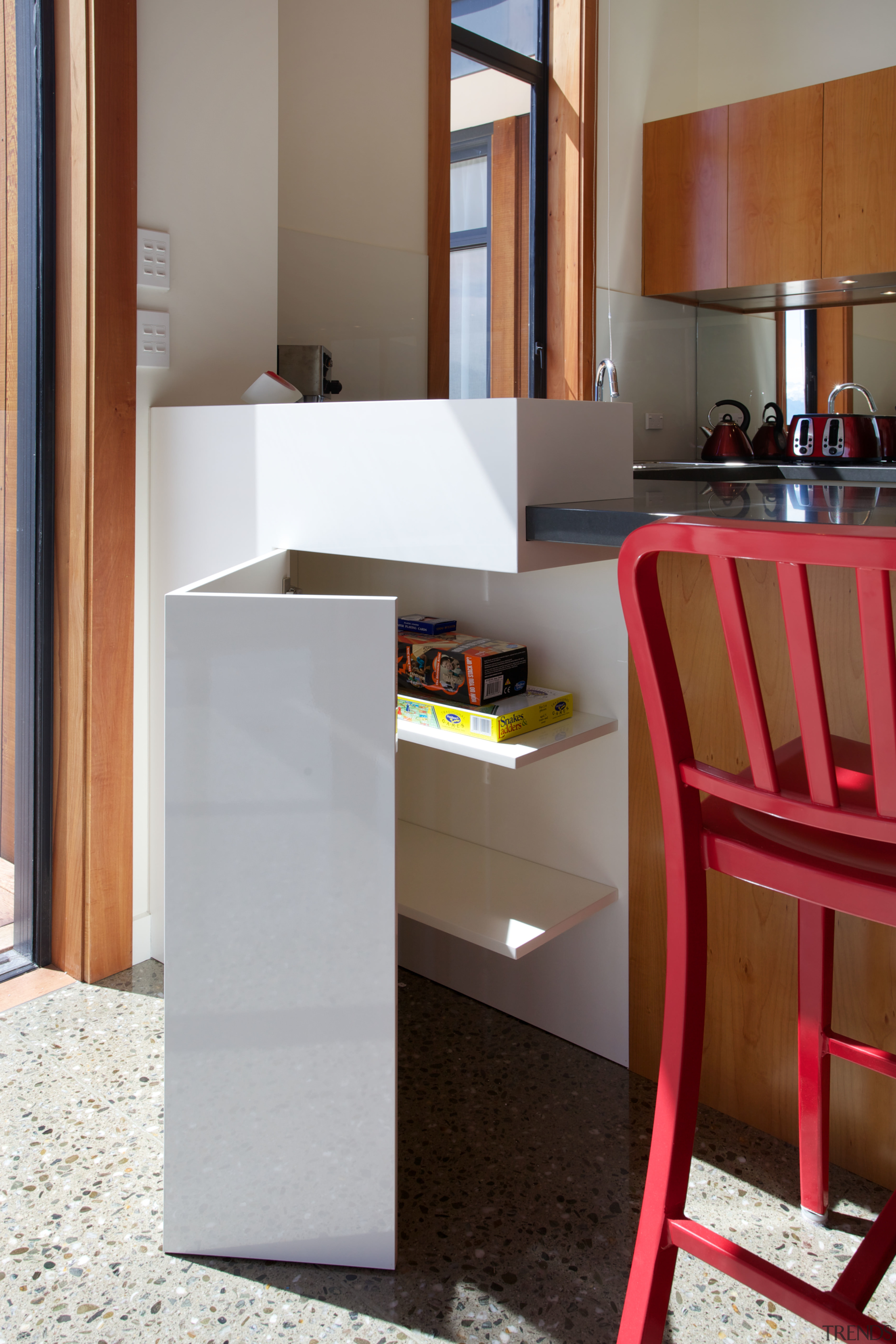 This side cabinet in a kitchen in a floor, flooring, furniture, interior design, product design, shelf, shelving, table, gray