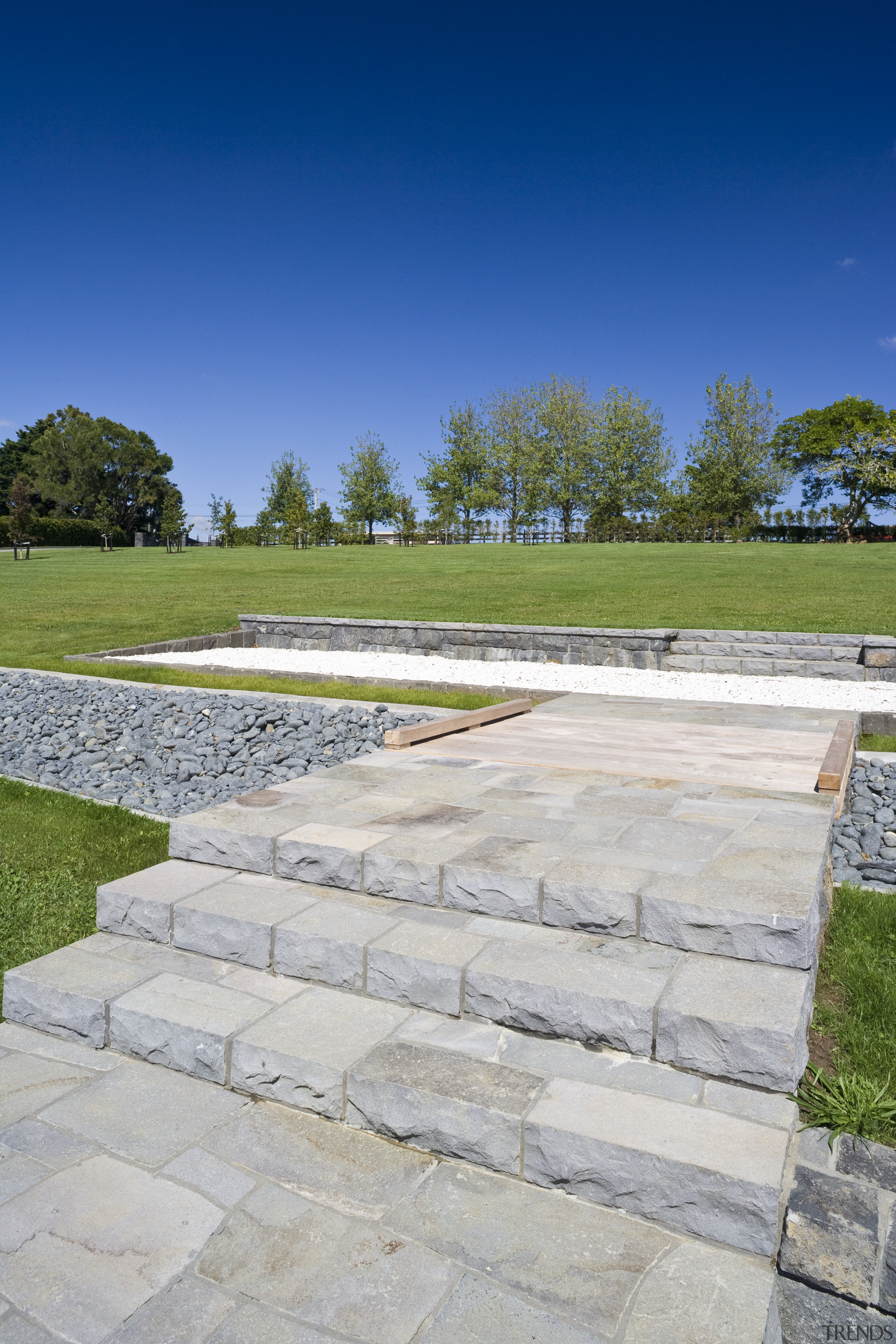 Image of stone walls which have been built asphalt, driveway, flagstone, grass, landscape, landscaping, lawn, path, road surface, sky, walkway, wall, gray, blue