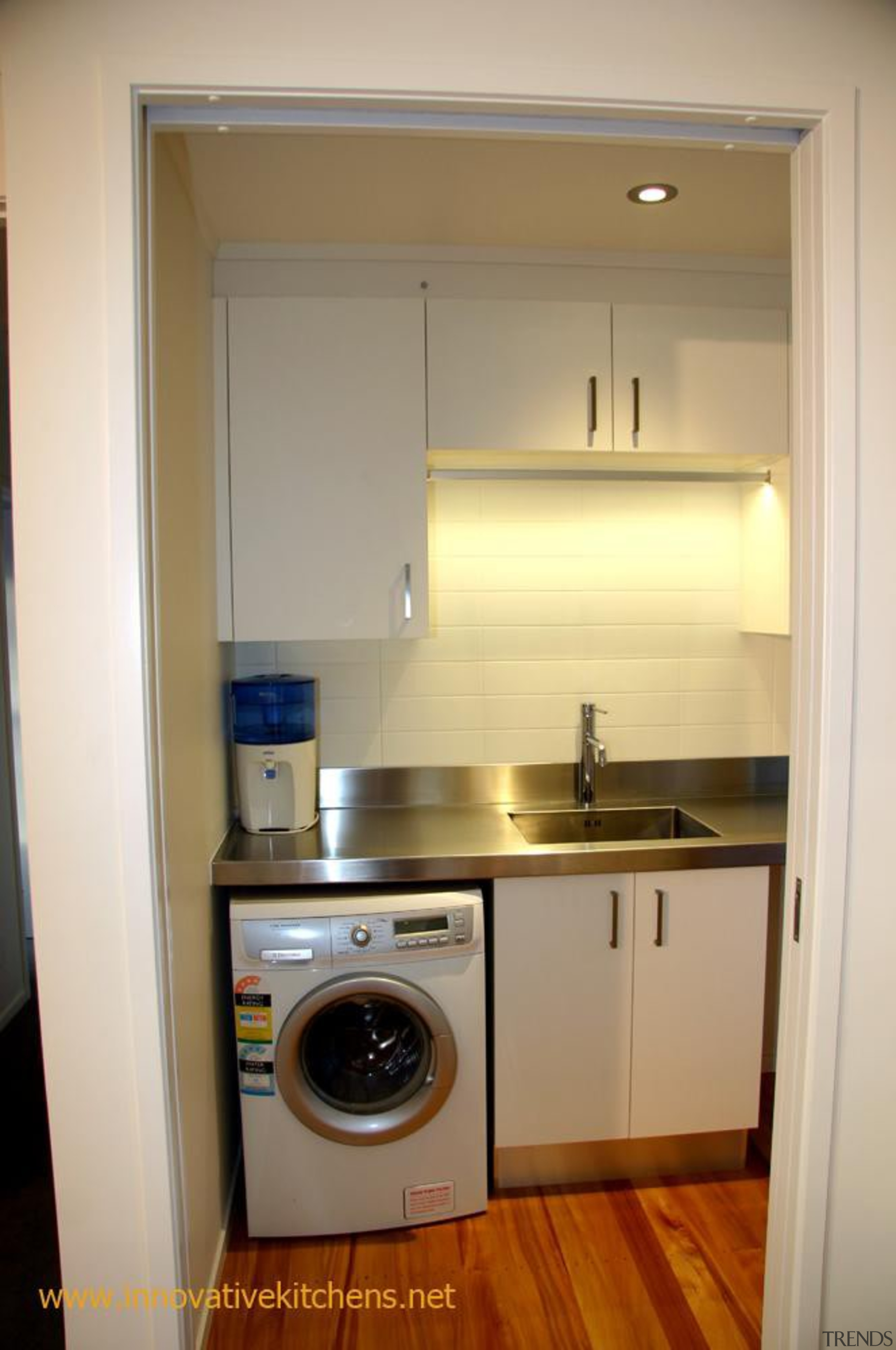 Laundry, clothes rail with LED lighting. - modern_glendowie_2013_6.jpg cabinetry, clothes dryer, countertop, home appliance, kitchen, laundry, laundry room, major appliance, property, room, washing machine, gray, brown