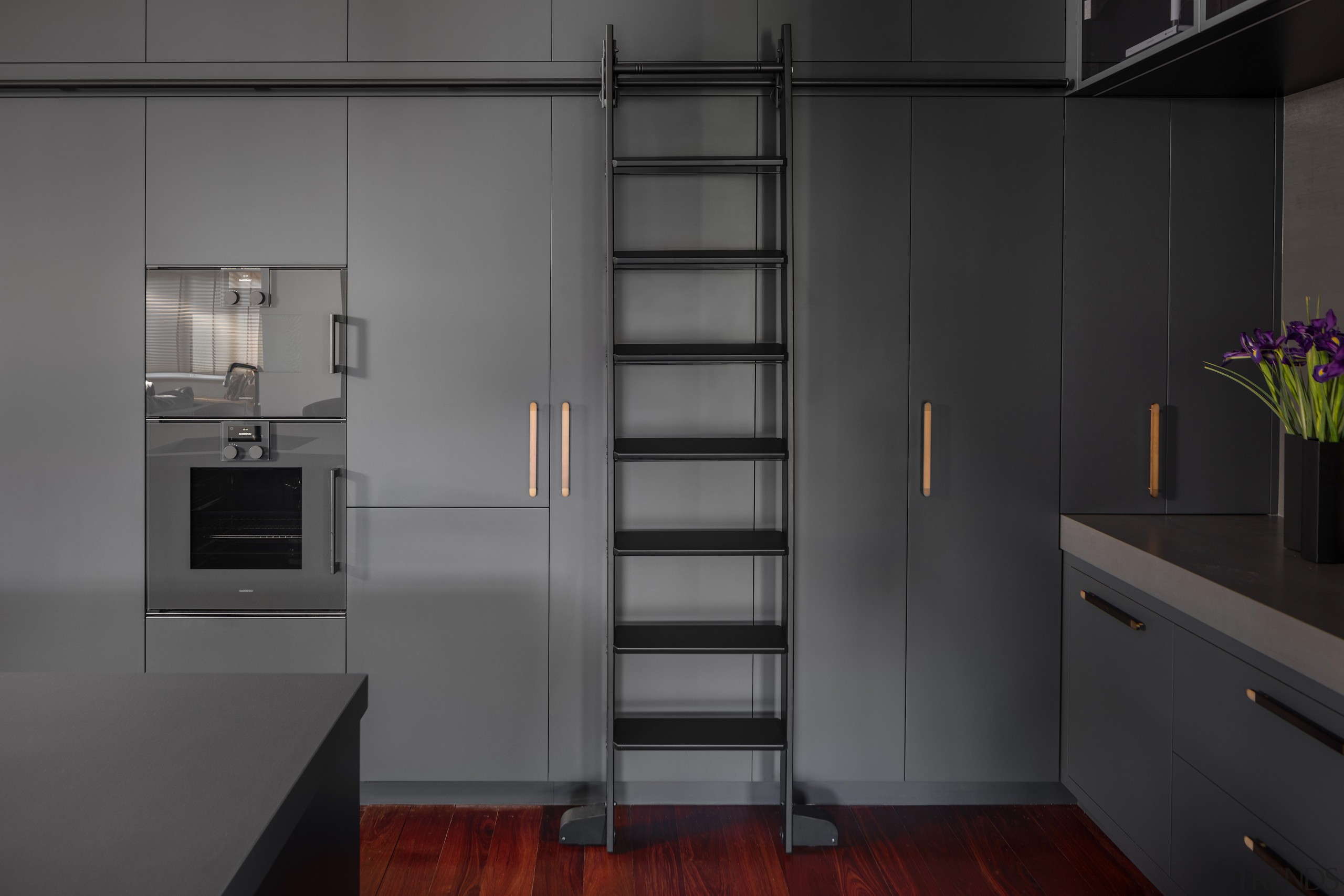 A functional industrial style ladder provides easy access 