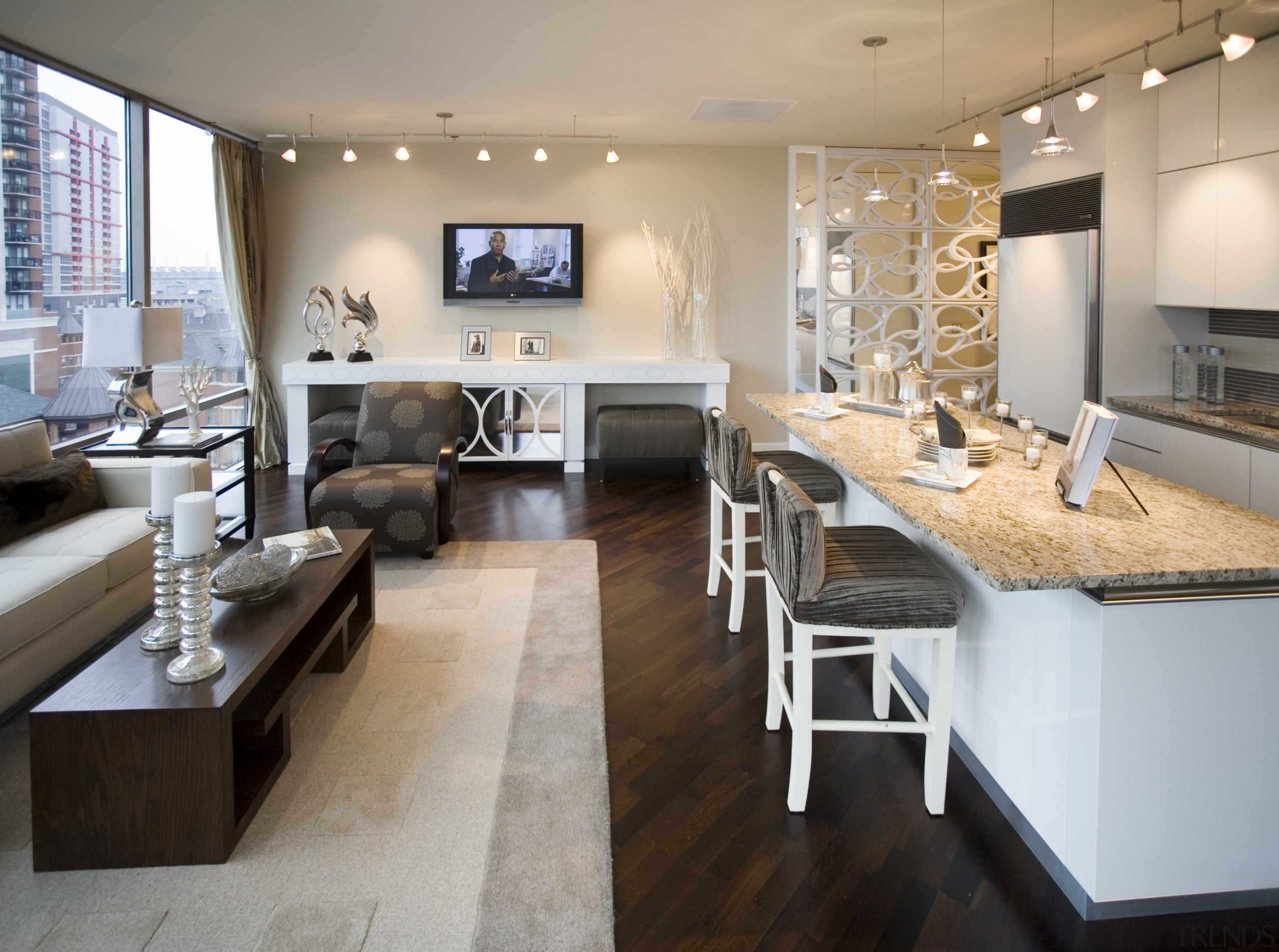 View of living space in the X/O development. floor, flooring, furniture, interior design, living room, room, gray