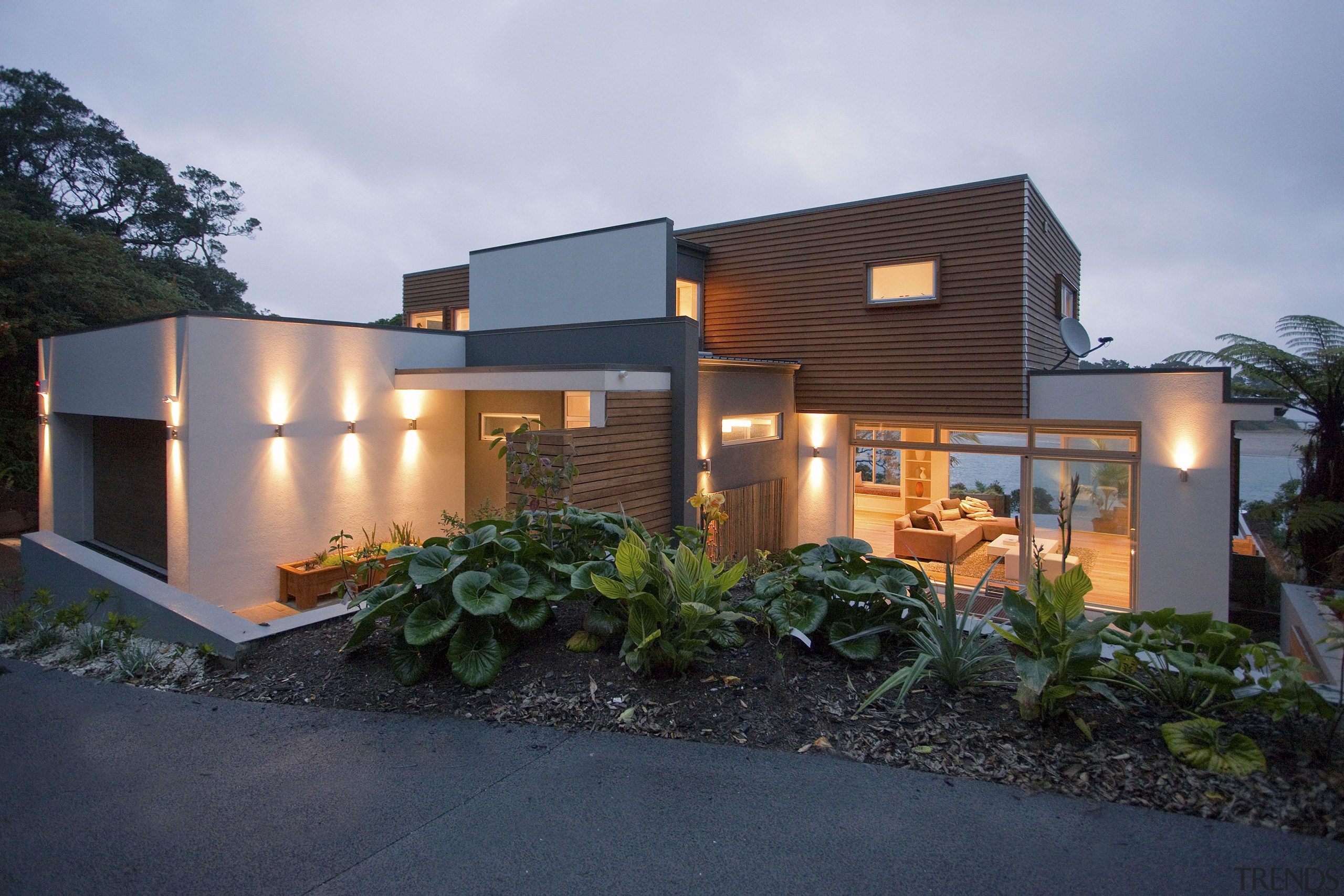 Evening view of contemporary home with gardens, exterior architecture, elevation, estate, facade, home, house, property, real estate, residential area, gray, black