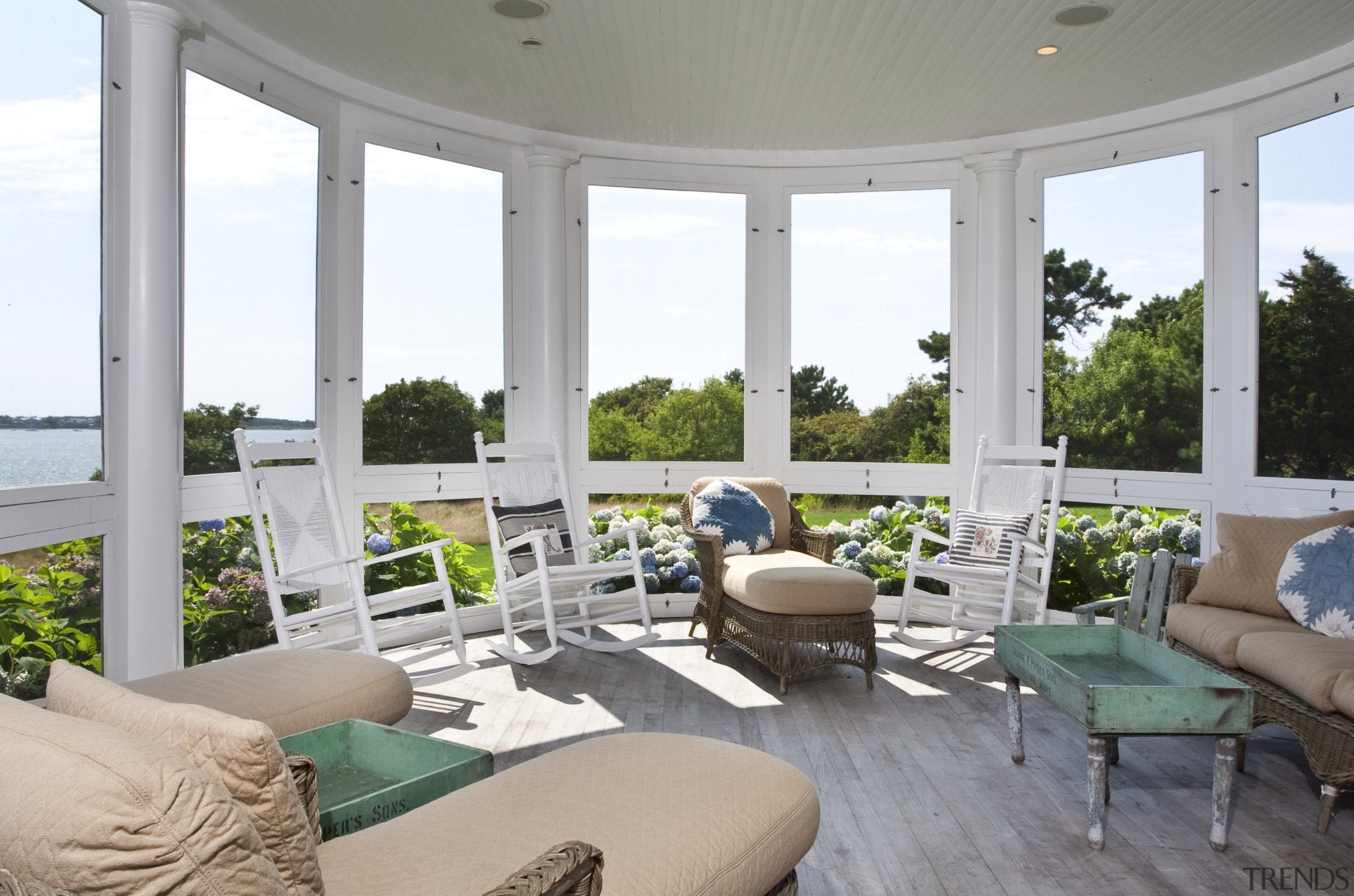 View of covered porch with wooden decking, loungers estate, home, interior design, living room, property, real estate, window, gray