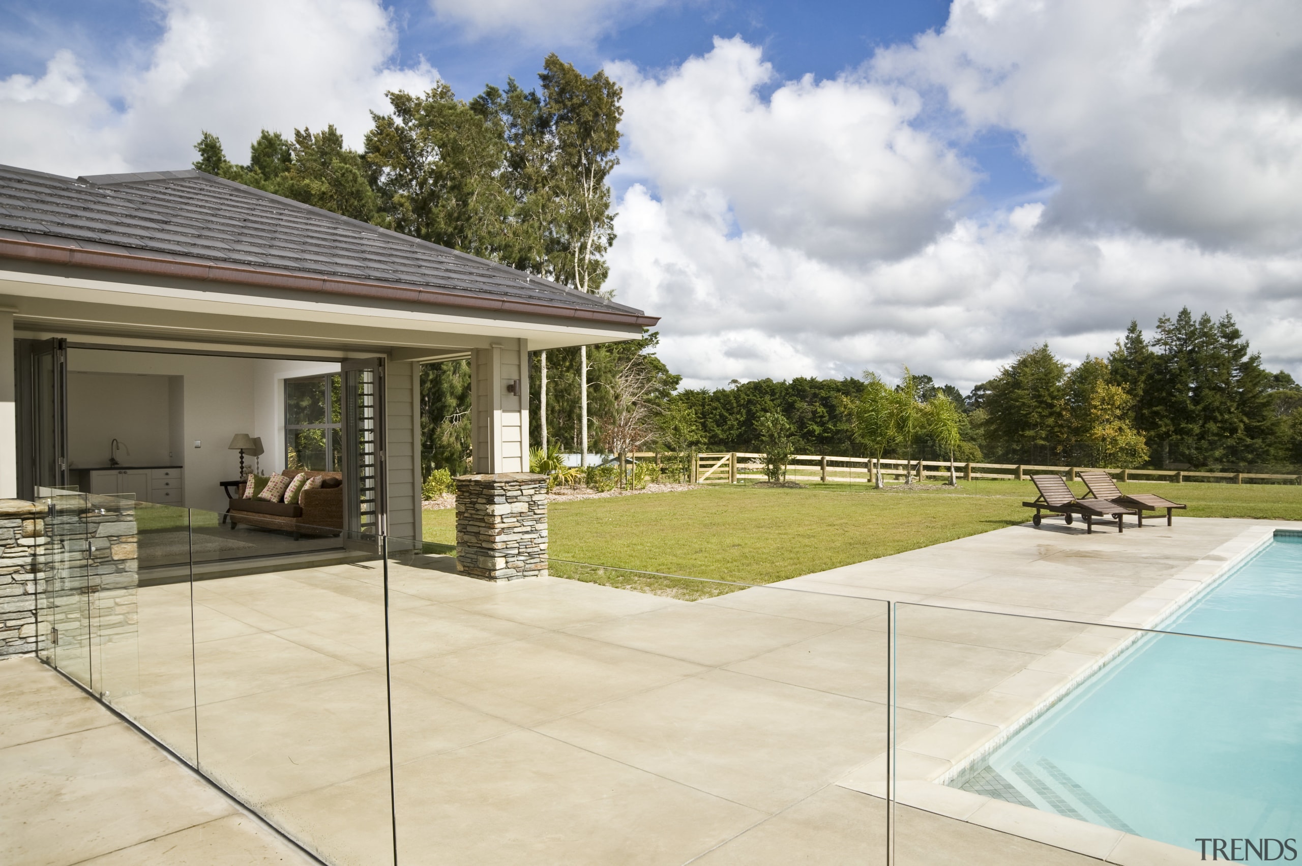 Image of coloured concrete from Peter Fell Ltd backyard, estate, home, house, outdoor structure, property, real estate, residential area, villa, yard, orange, white