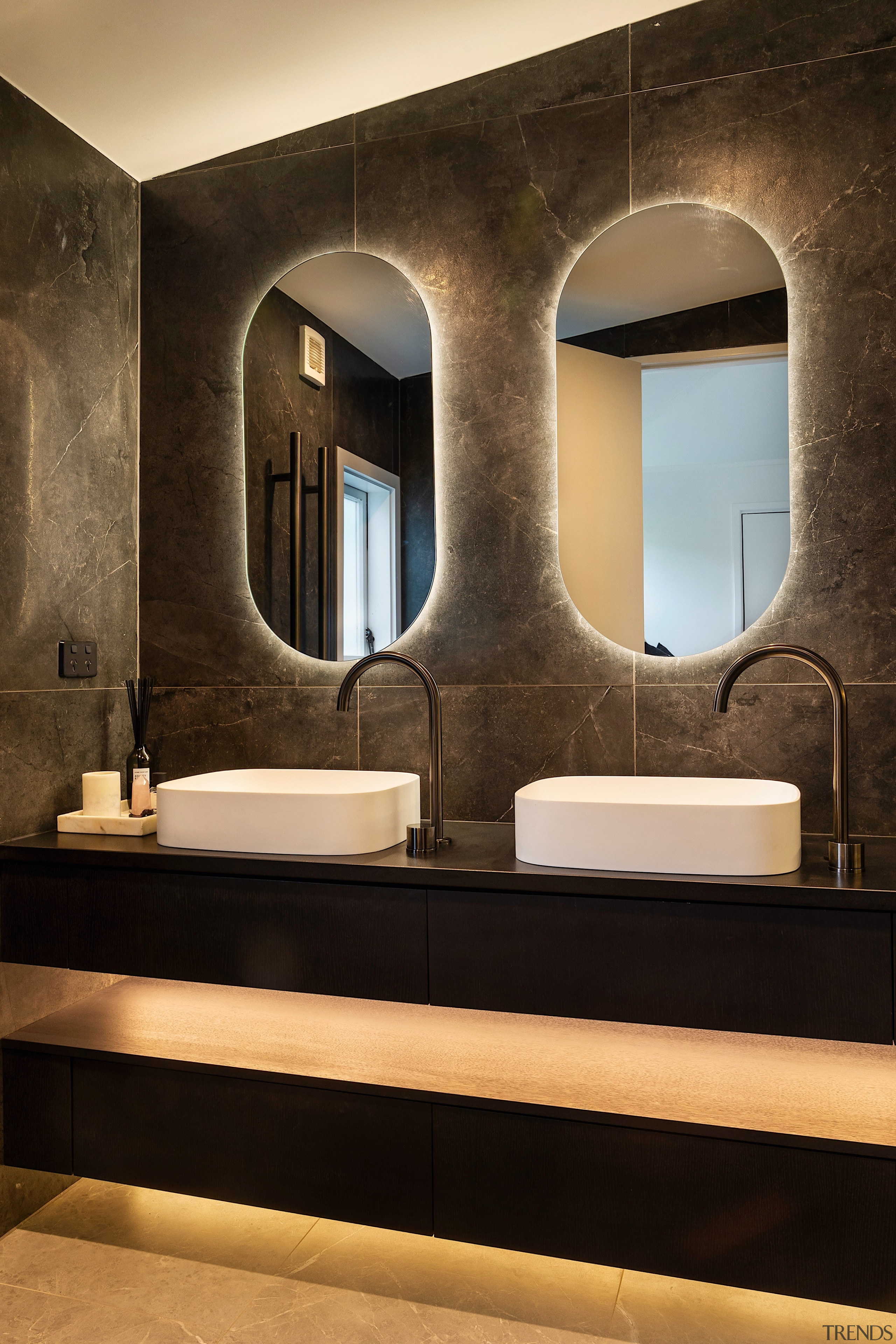 The vanity is parred back and modern – 