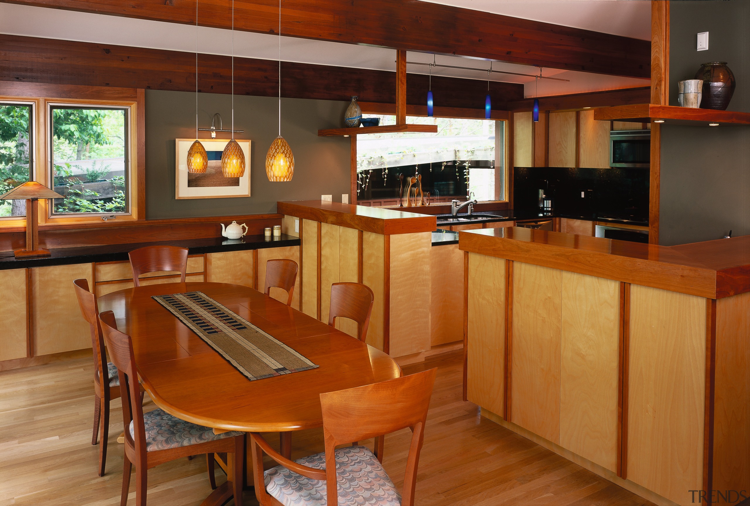 A view of the kitchen and dining areas, cabinetry, countertop, cuisine classique, hardwood, interior design, kitchen, real estate, room, wood, brown