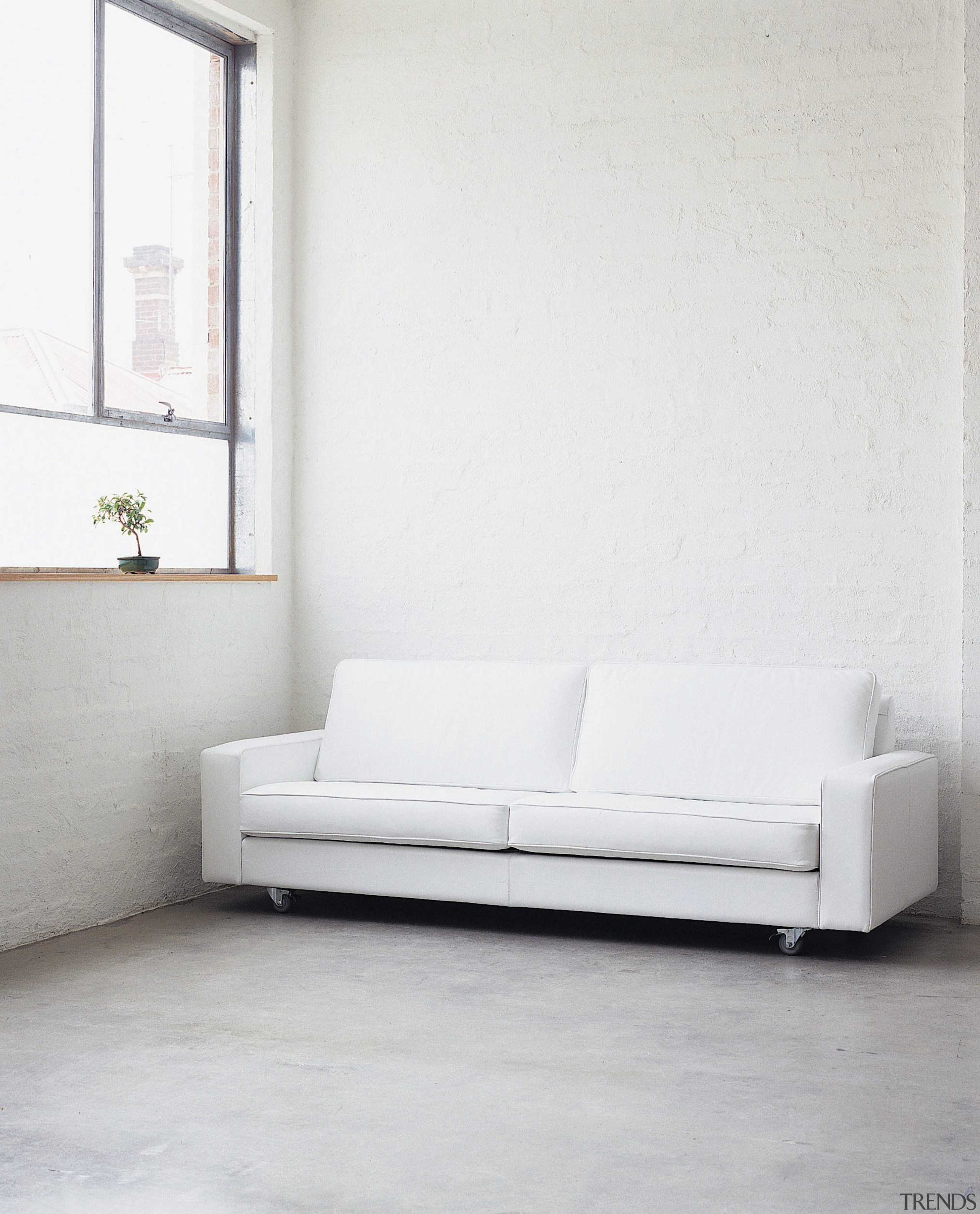 view of the odessa mk2 in white leather angle, bed, bed frame, couch, floor, flooring, furniture, futon, interior design, loveseat, product design, sofa bed, studio couch, table, wall, wood, white