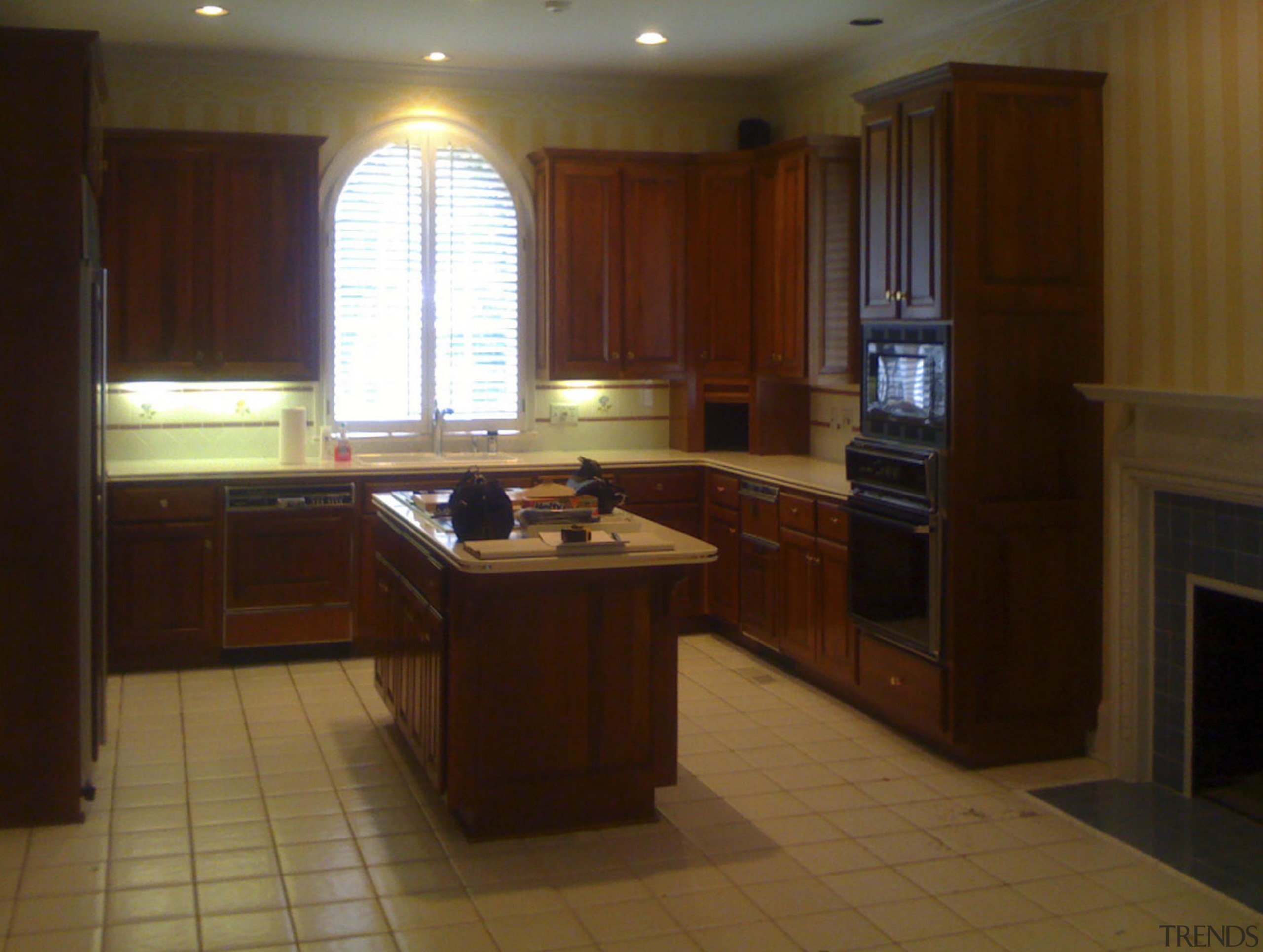 before image. tiled or linoleum floor, unused hearth, cabinetry, countertop, cuisine classique, floor, flooring, hardwood, interior design, kitchen, property, real estate, room, wood, wood flooring, brown, red