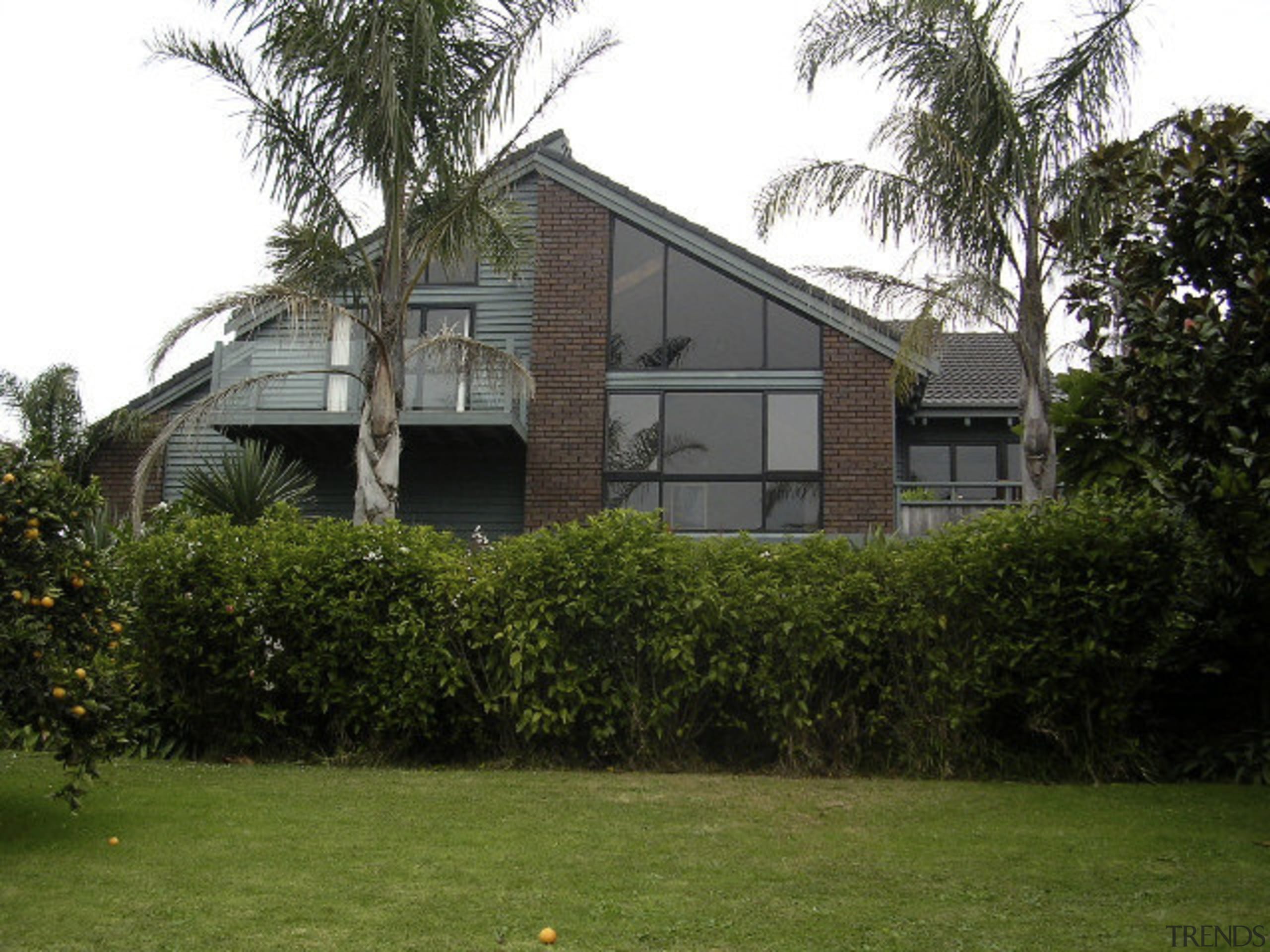 Exterior view of home prior to renovations. - architecture, building, cottage, estate, facade, farmhouse, grass, home, house, lawn, neighbourhood, plant, property, real estate, residential area, roof, siding, tree, villa, window, yard, brown