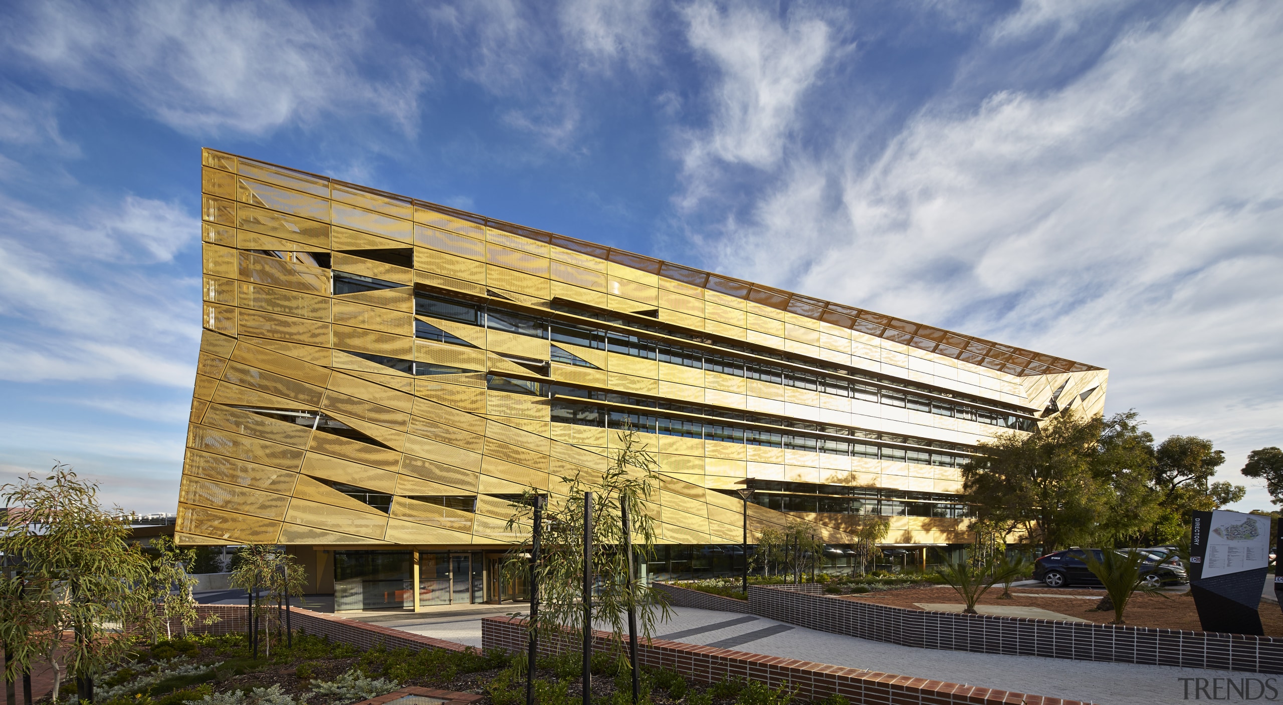 A golden canopy and veil enliven the exterior architecture, building, commercial building, corporate headquarters, facade, headquarters, house, mixed use, real estate, residential area, sky, gray