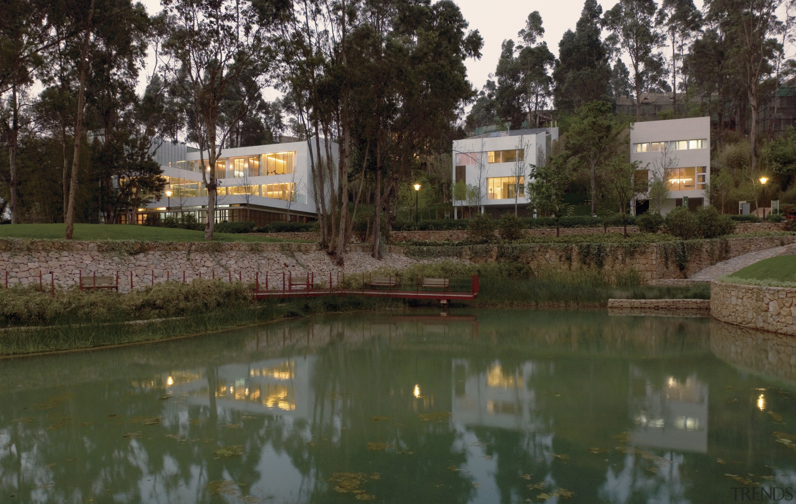 View of housing developments in the Kunming Valley. estate, home, house, landscape, plant, real estate, recreation, reflection, tree, water, waterway, brown