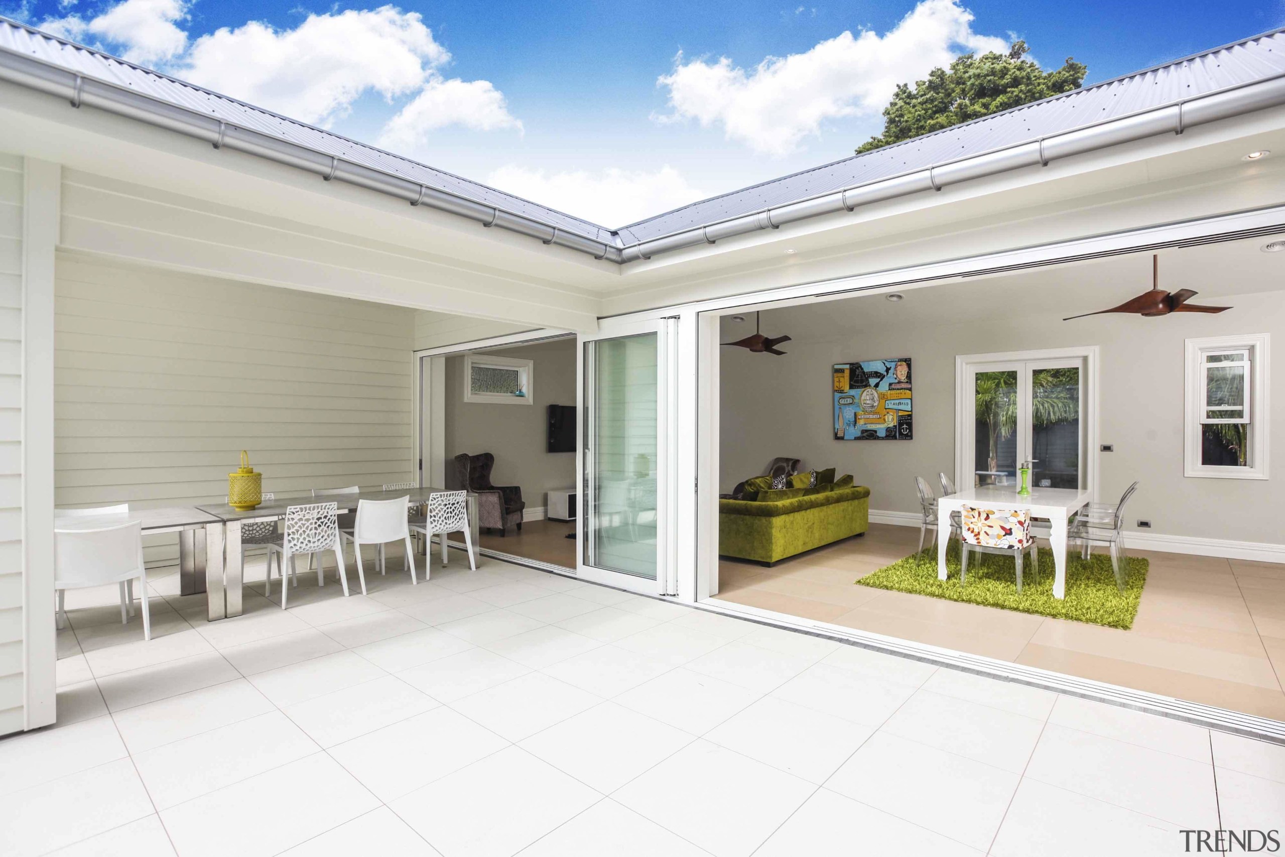 The sheltered outdoor room is ideal for entertaining estate, home, house, property, real estate, window, white, gray