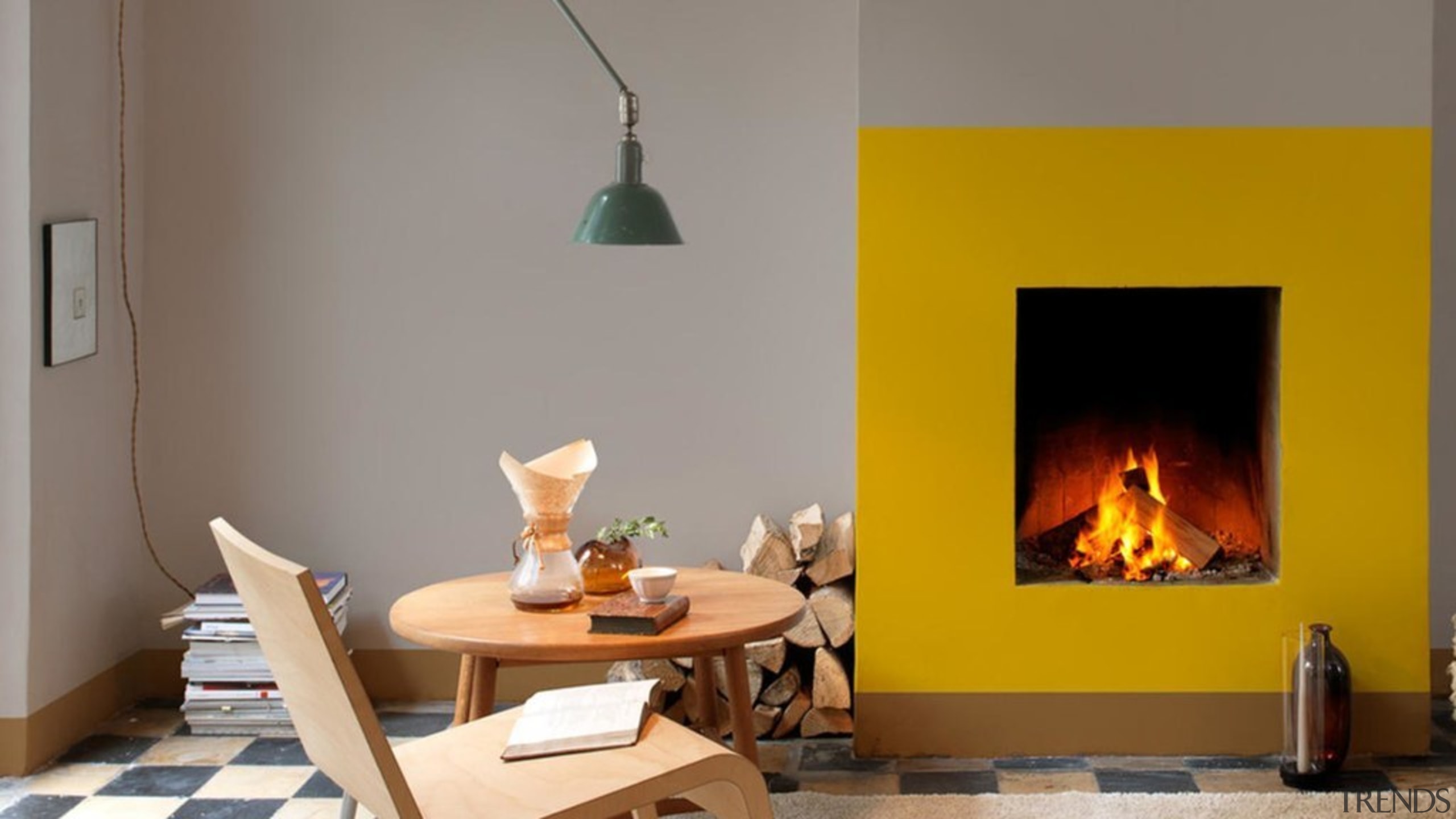 What could have been a forgettable fireplace was fireplace, furniture, hearth, heat, home, interior design, living room, orange, room, table, wood-burning stove, gray