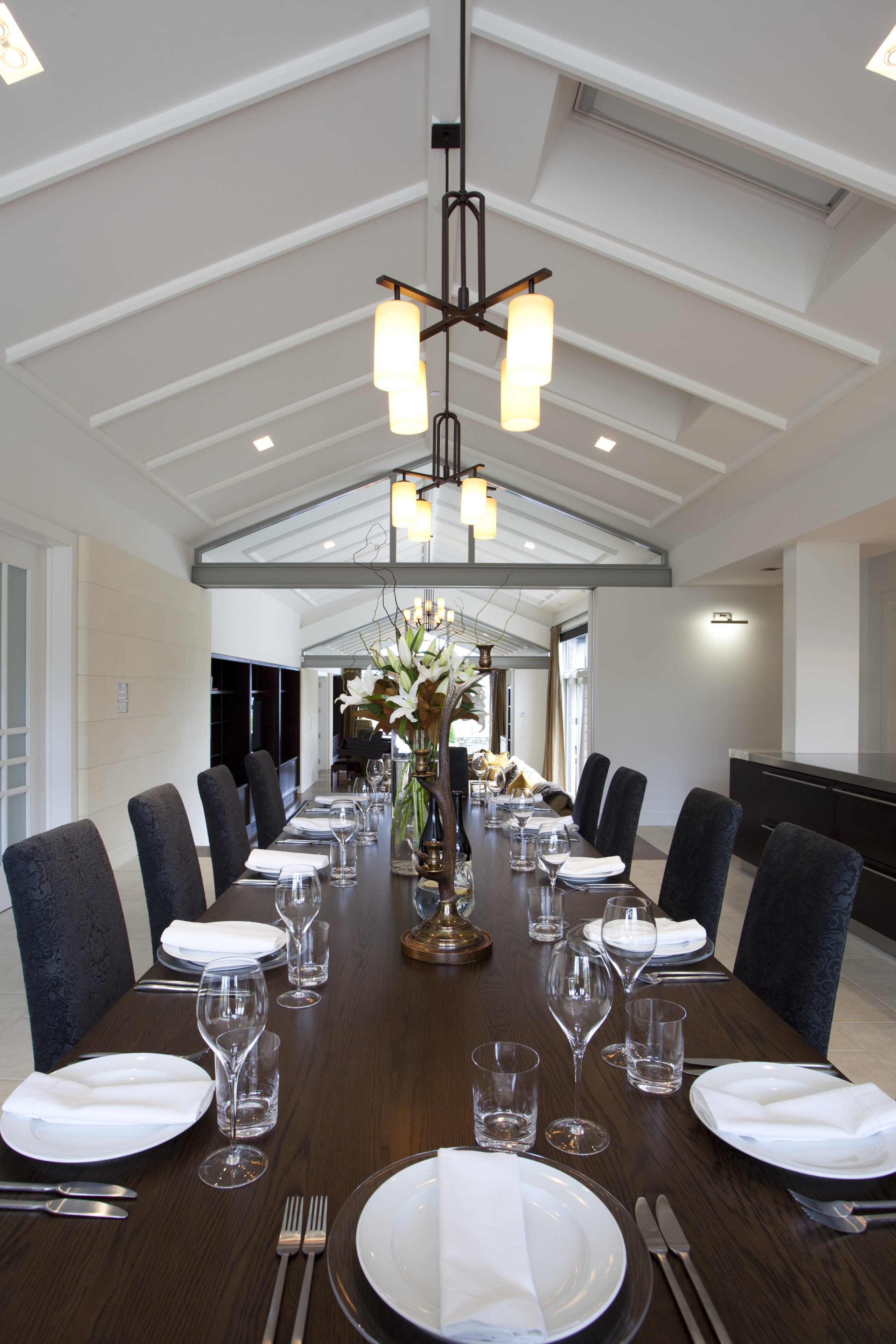 Dining table 12-seater, gabled roof, white walls white ceiling, chandelier, dining room, function hall, furniture, interior design, light fixture, lighting, restaurant, room, table, gray, black