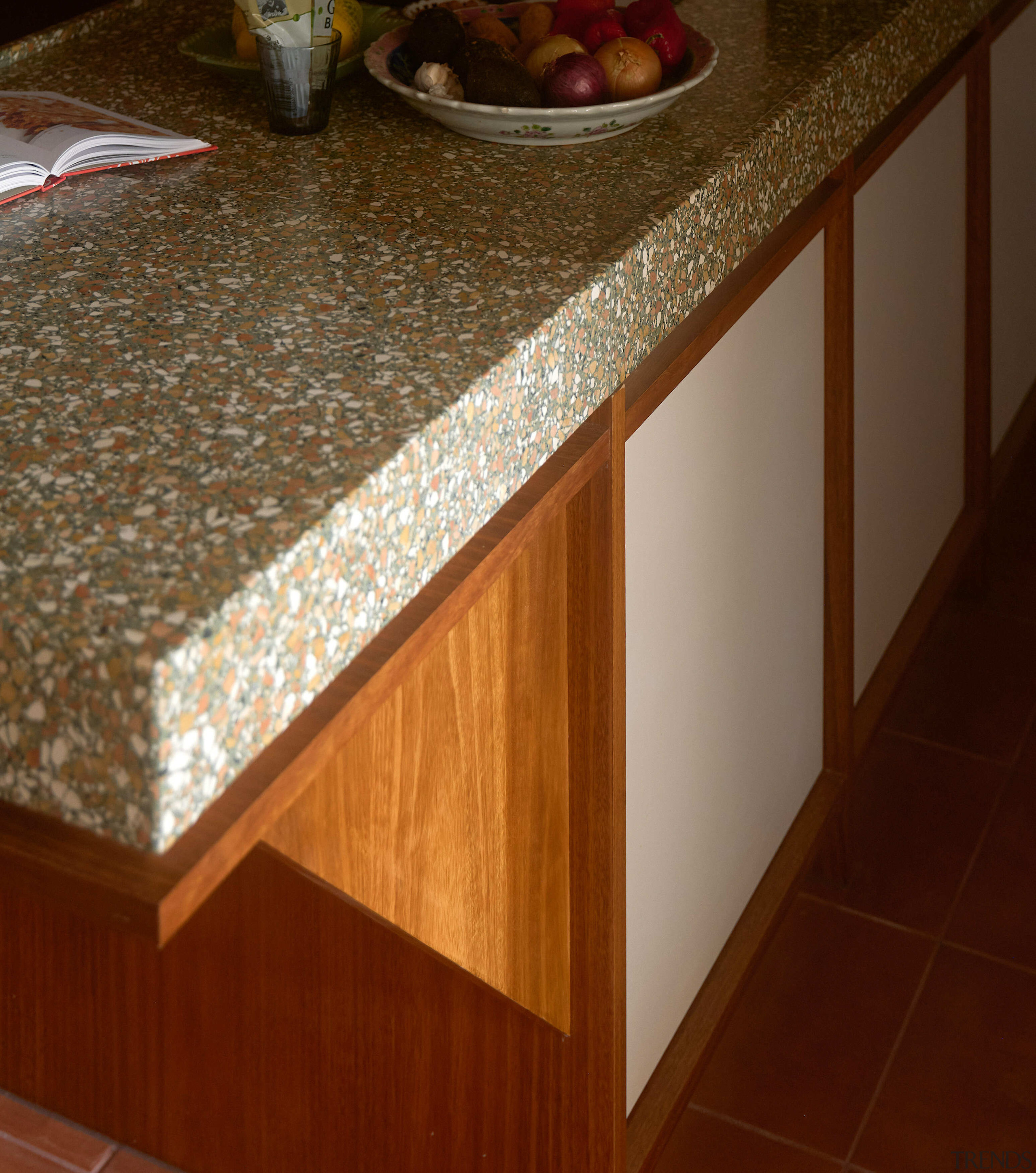 Terrazzo meets rich timber tones – island detail. 