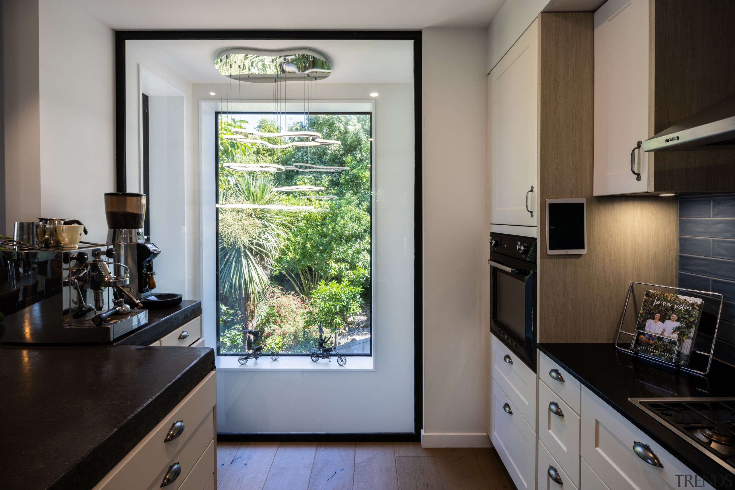 Every space, kitchen included, engages the verdant setting. 