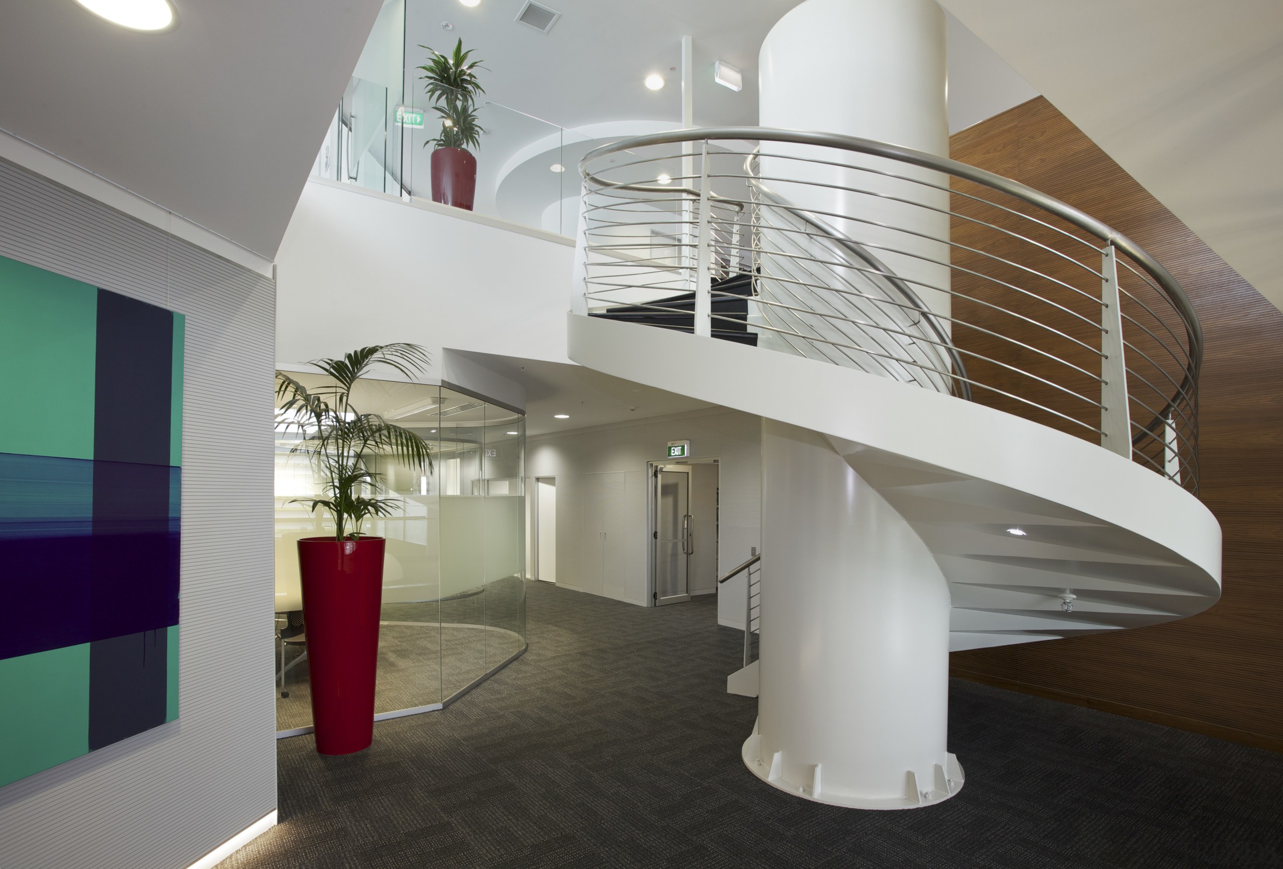 A large spiral staircase links the two levels architecture, ceiling, daylighting, interior design, lobby, product design, stairs, gray