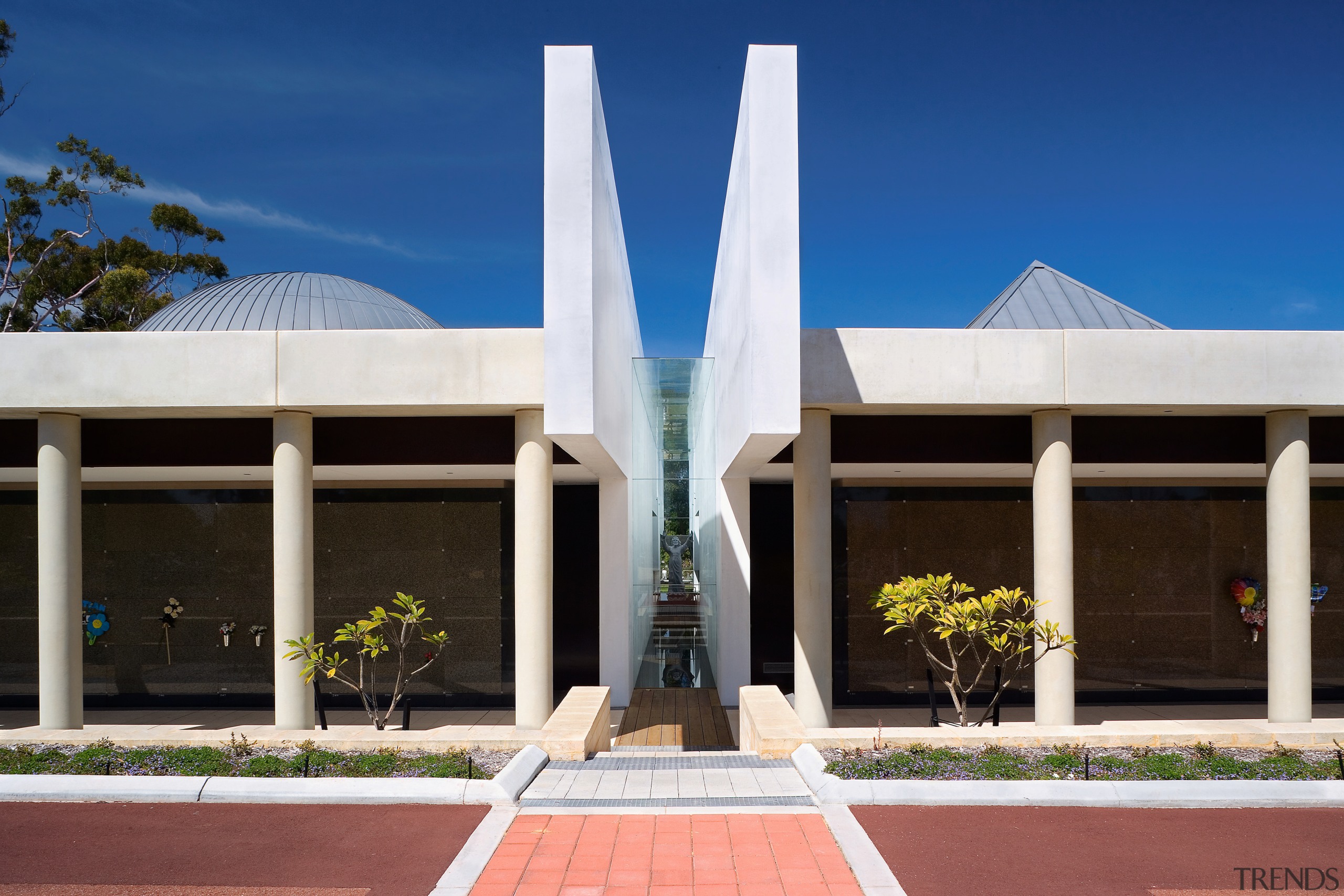 Exterior view of the freemantle Mausoleum featuring glass architecture, building, corporate headquarters, daytime, facade, home, house, real estate, sky, blue