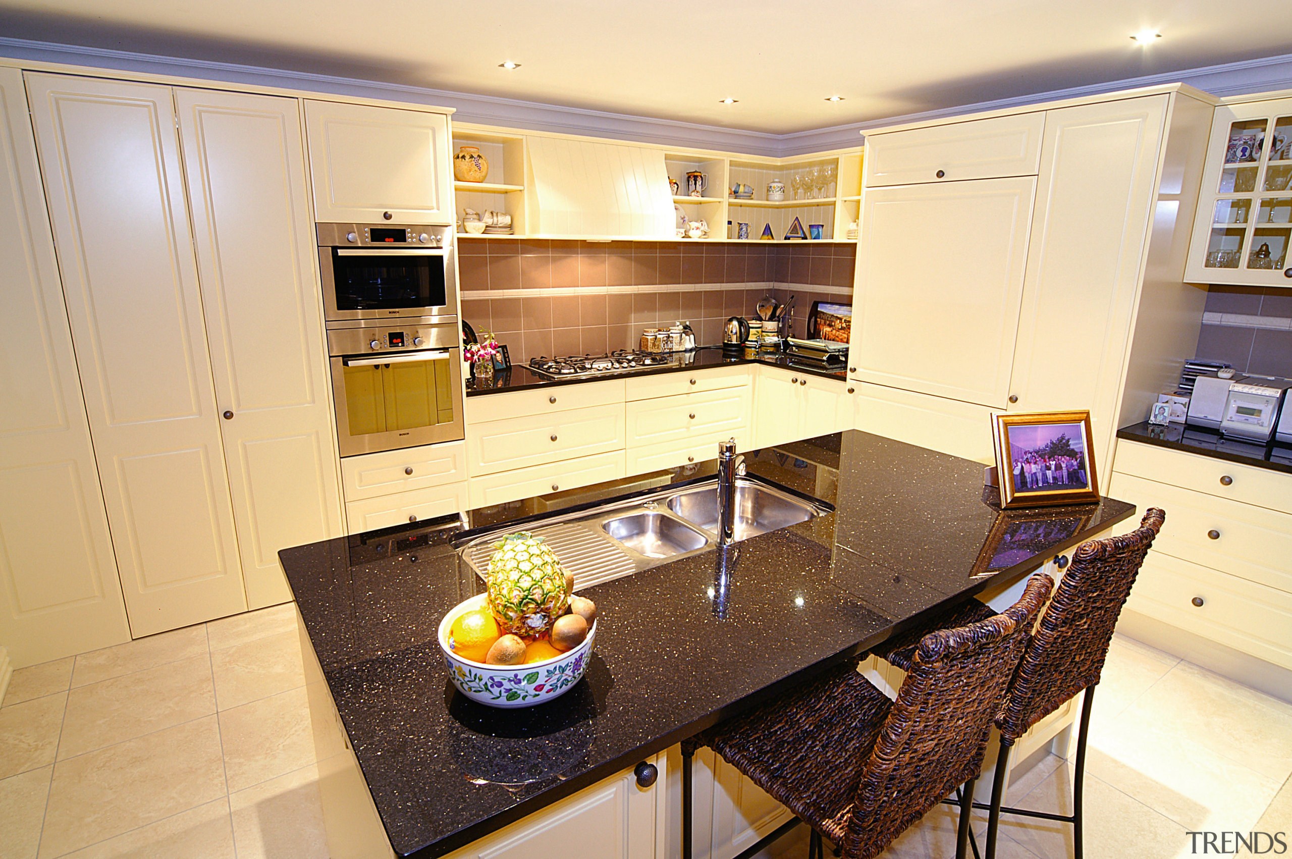 view of the english style kitchen featuring cream countertop, interior design, kitchen, real estate, room, orange