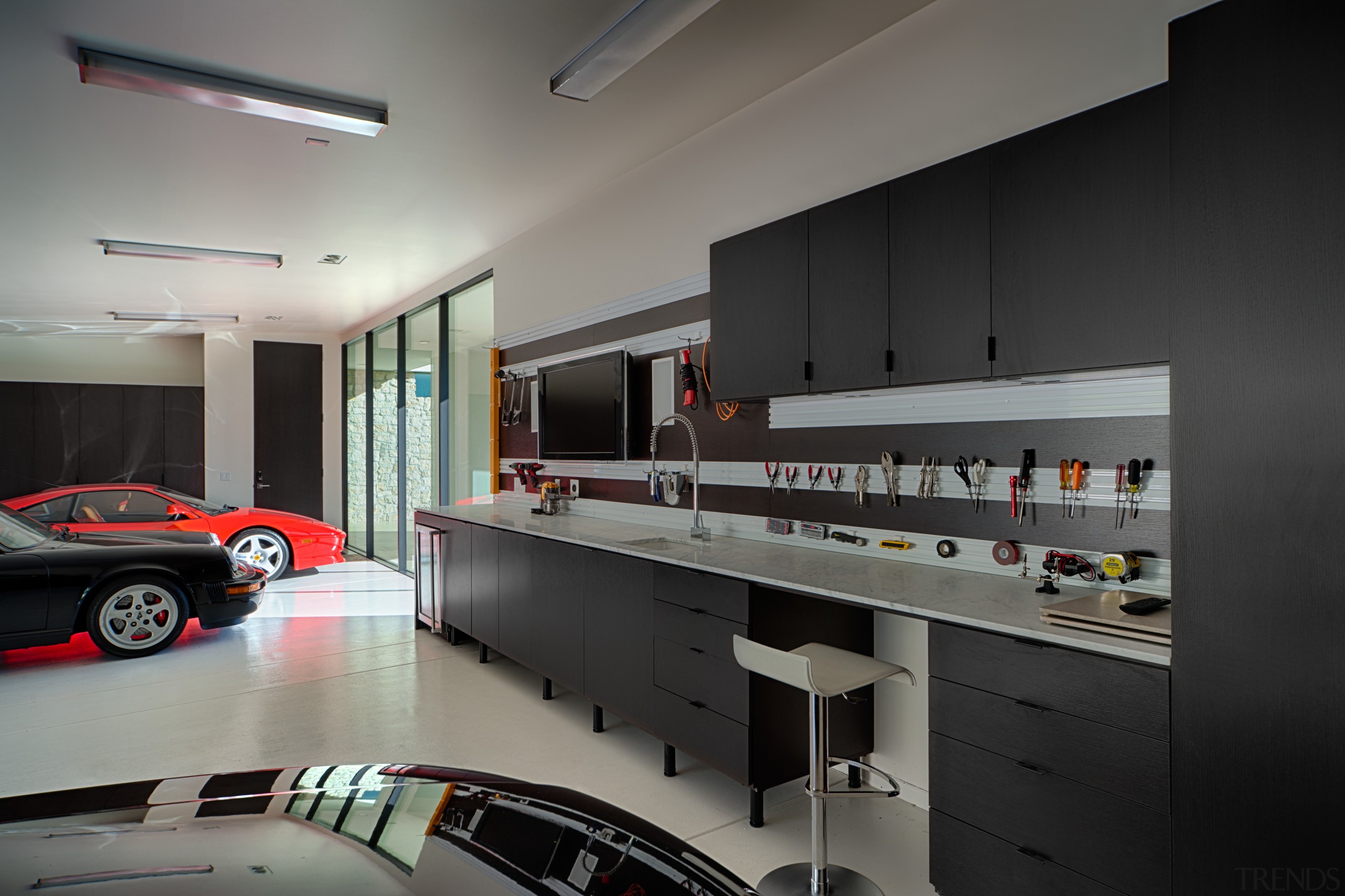 Garaging in new California house by architect Mark interior design, gray, black