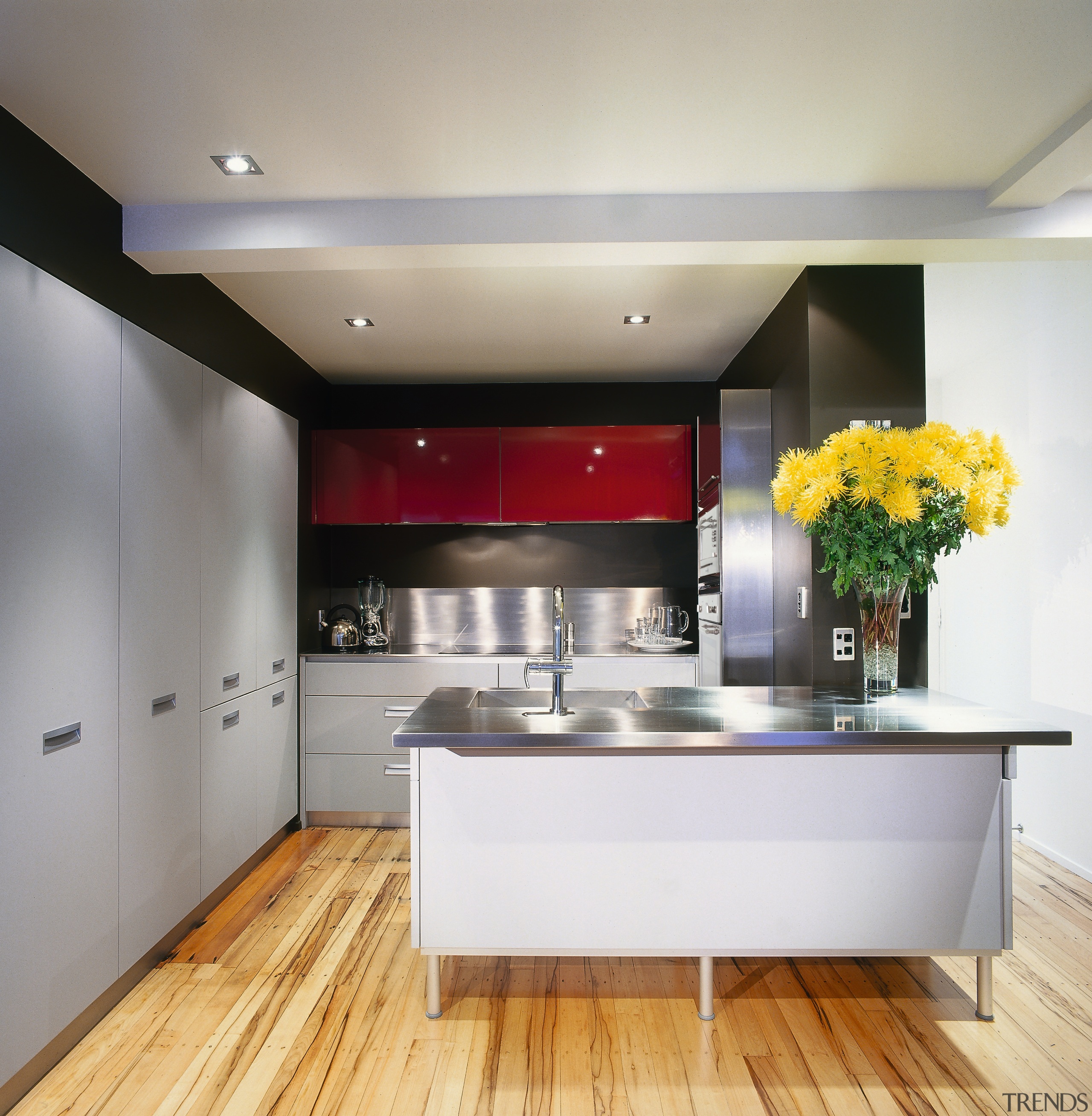 A view of a kitchen, wooden flooring, grey cabinetry, ceiling, countertop, interior design, kitchen, room, gray