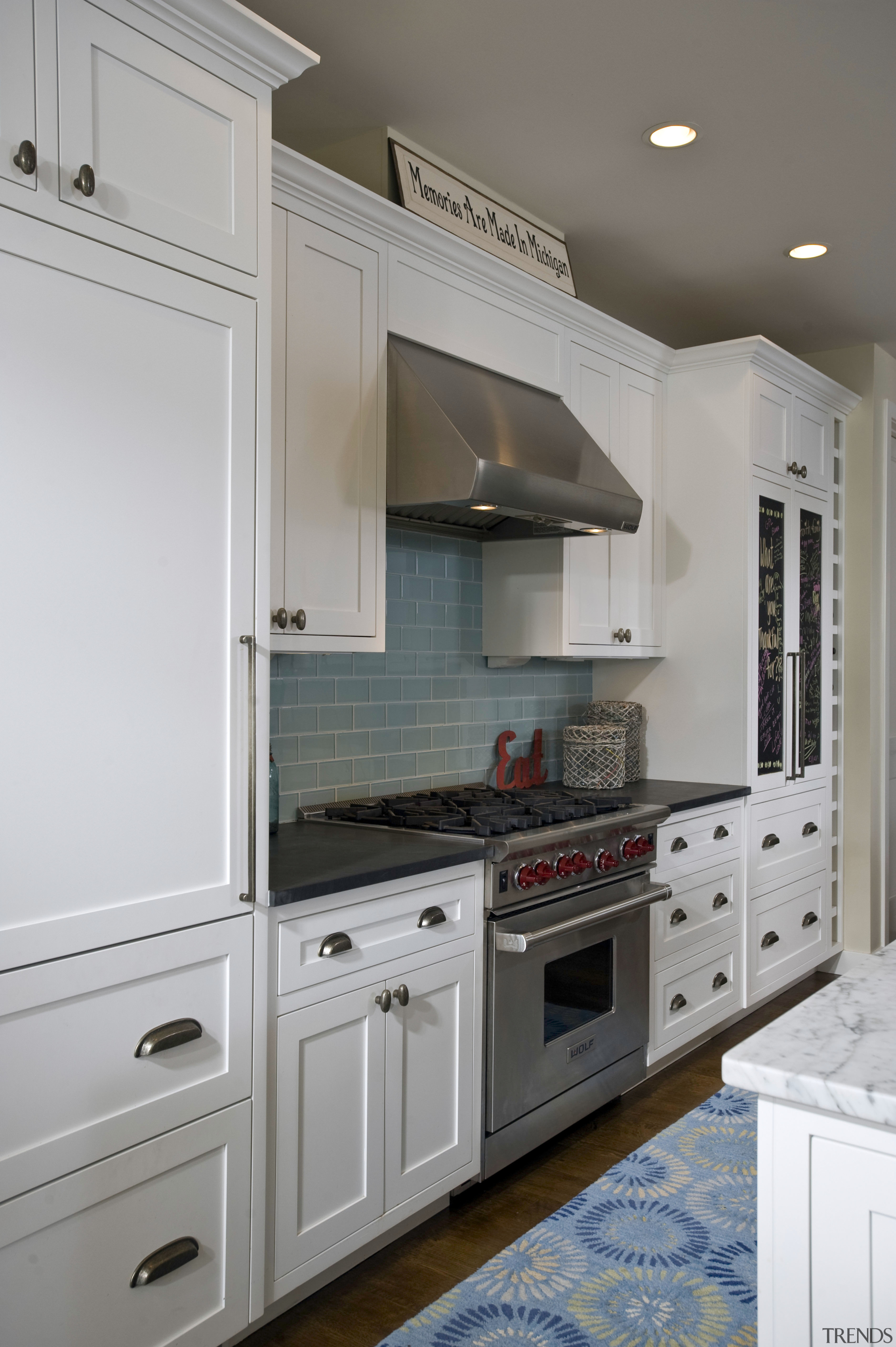 View of kitchen with white cabinetry and glass cabinetry, countertop, cuisine classique, floor, flooring, home, home appliance, interior design, kitchen, room, gray
