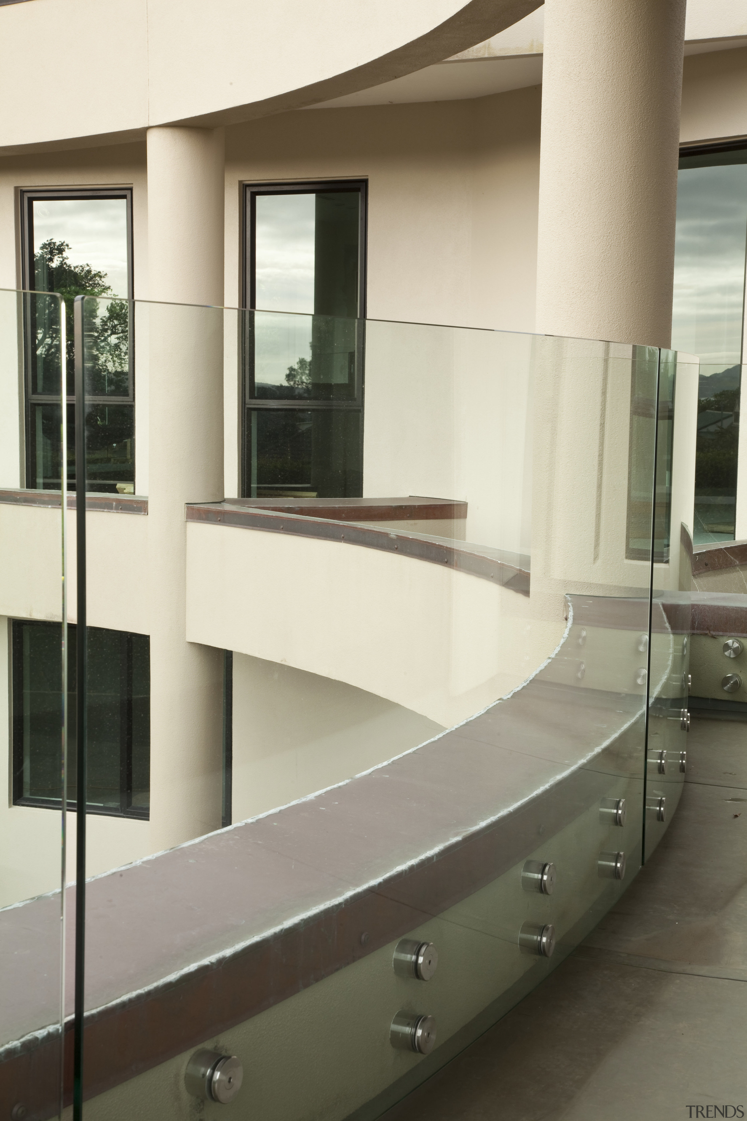 View of home with curved, toughened glass balustrade. architecture, floor, furniture, glass, handrail, interior design, stairs, white