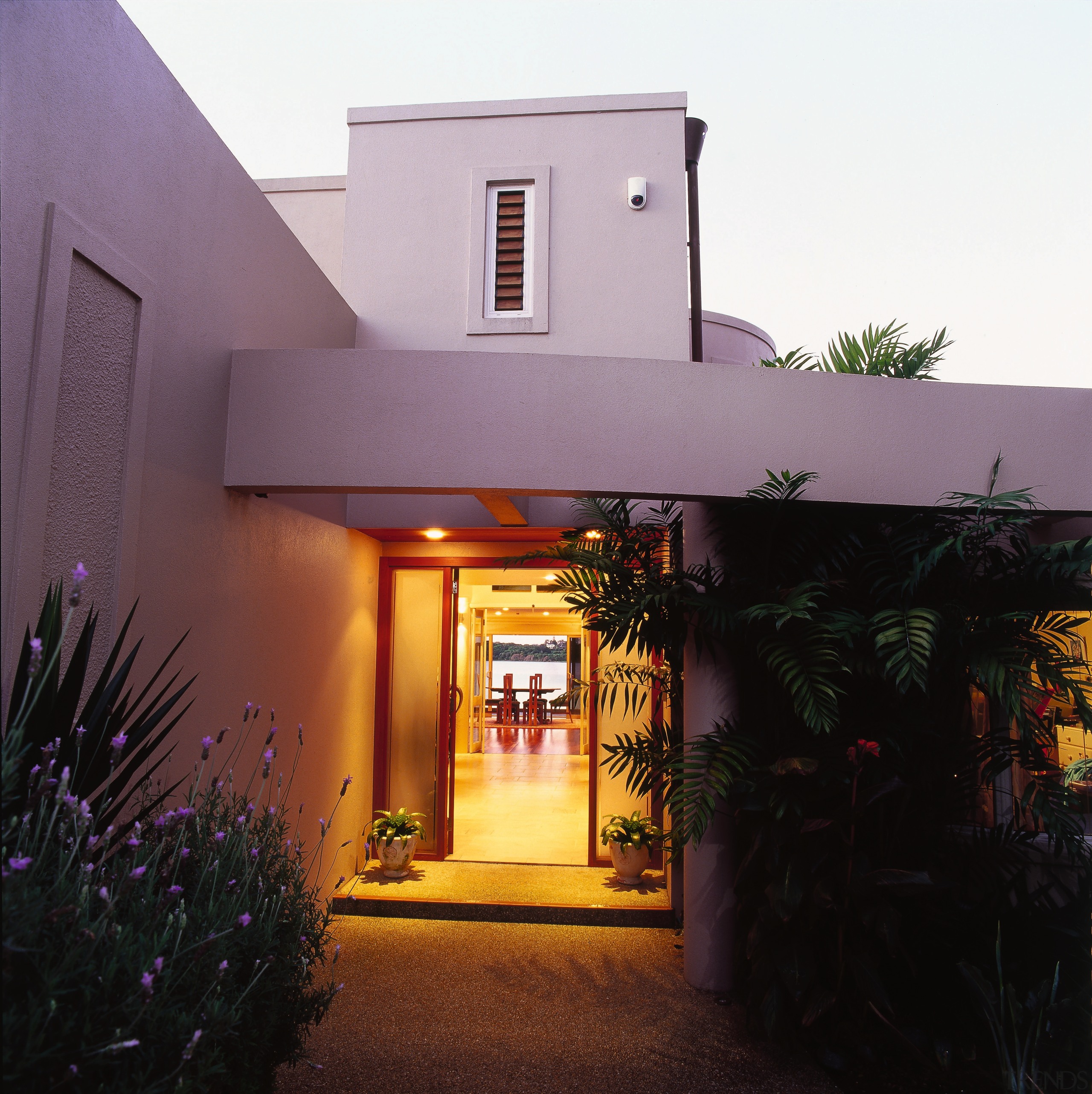 Entranceway to house with bright-lit formal look, and architecture, building, estate, facade, hacienda, home, house, lighting, property, real estate, black